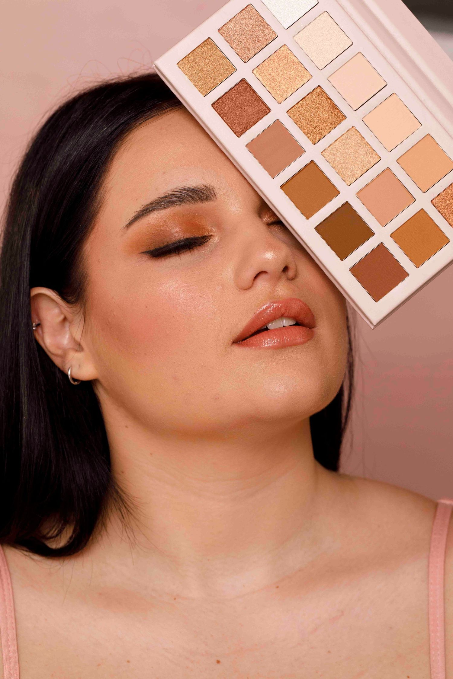 Close-up beauty shots showing eyeshadow palette swatches and makeup application in warm neutral tones.