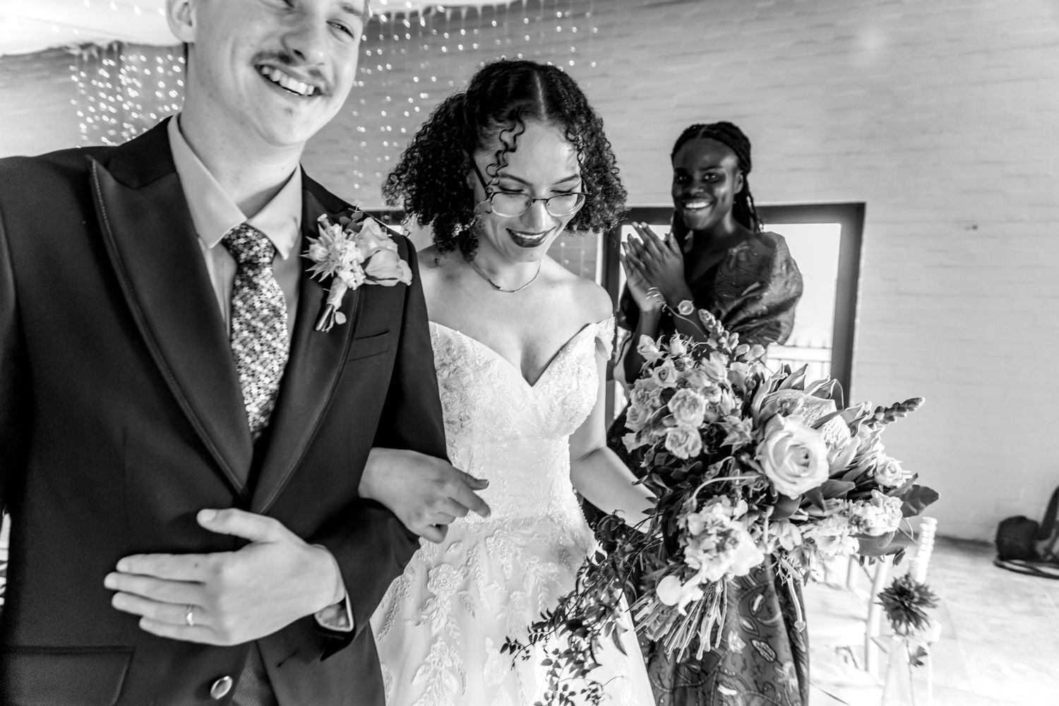 A black and white collection of wedding party photos showing couples posing with bouquets and formal attire.