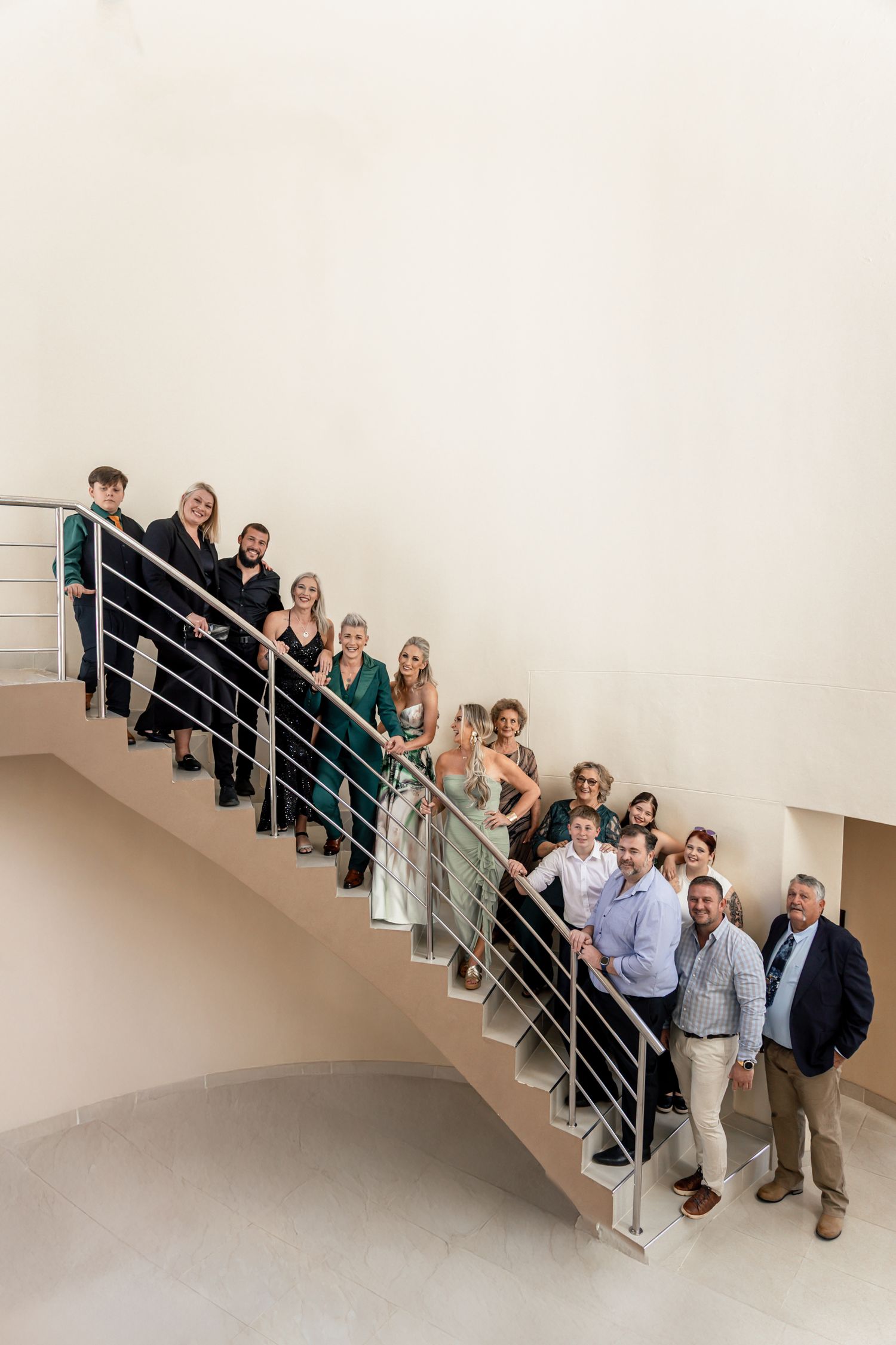 A sequence of photos showing a group of people arranged on a modern staircase for a creative group portrait.