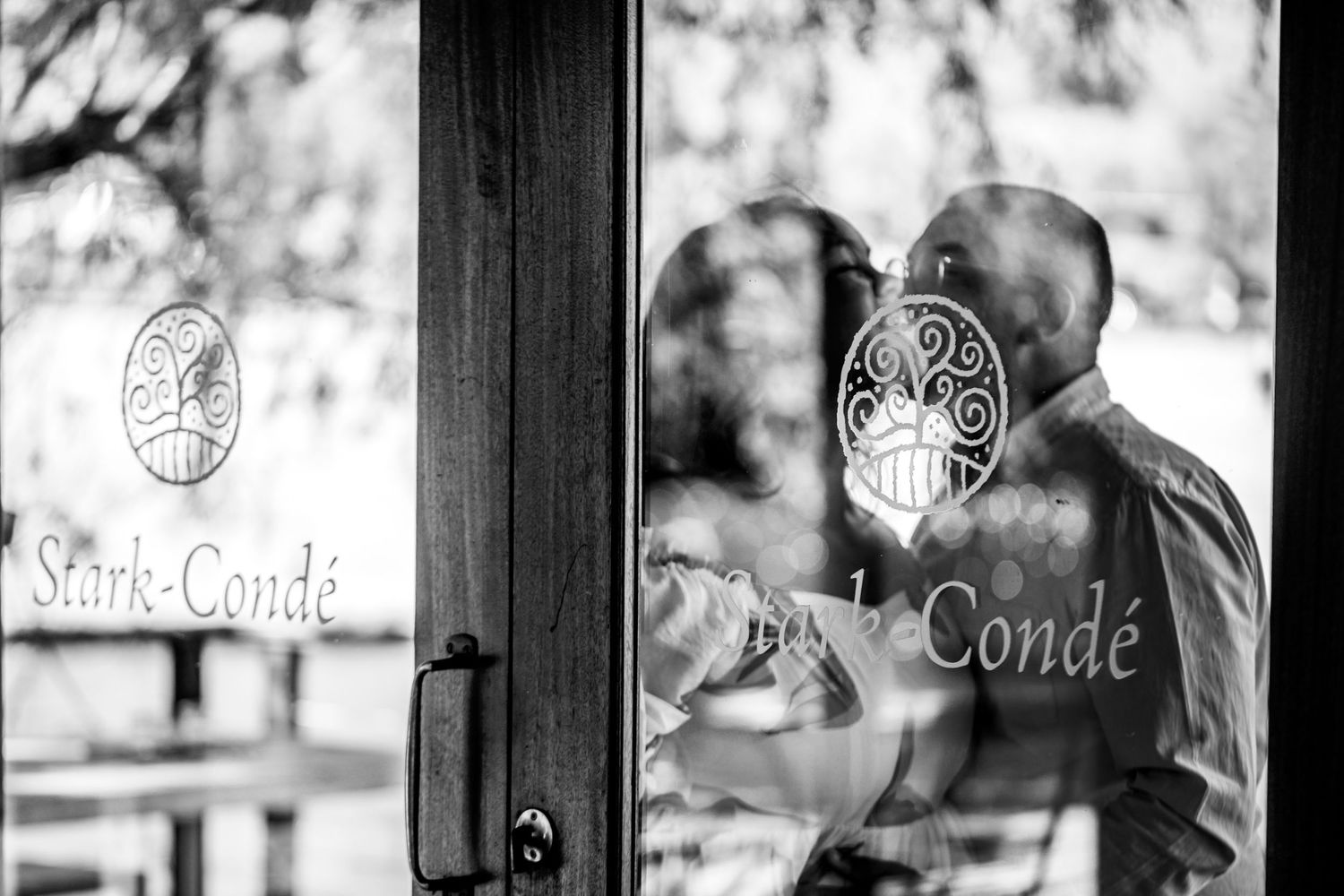 Decorative glass window panes with the word 'Conde' etched in an elegant script design.