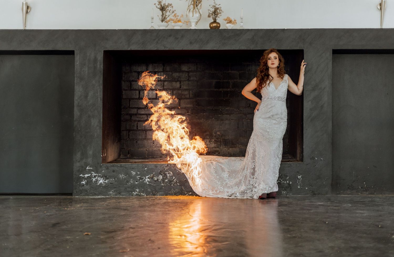 A progression of fire performance art photos showing sparking flames and dance movements in a dark industrial space.