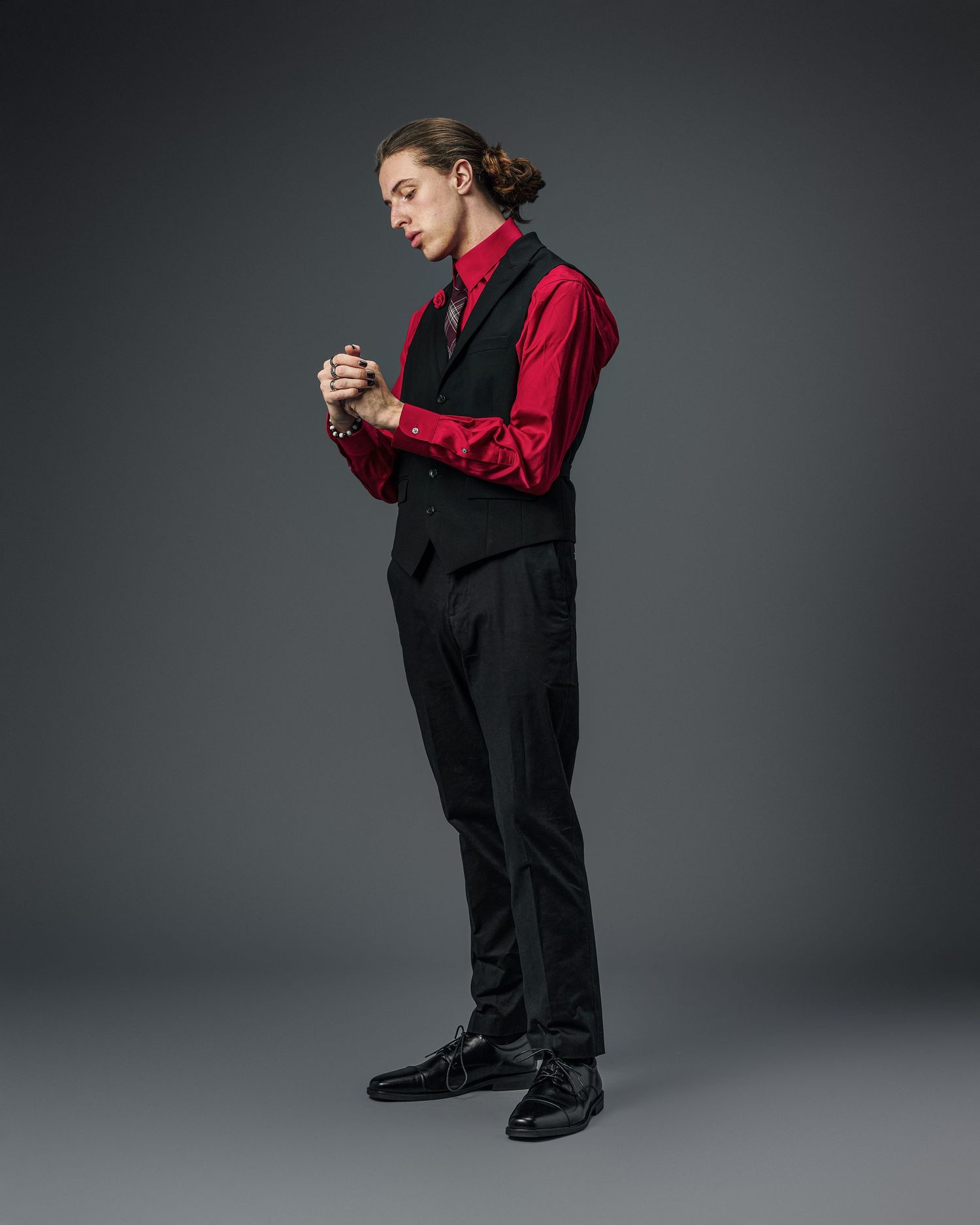 Fashion series showing oversized black and red outfit combinations with dramatic posing.