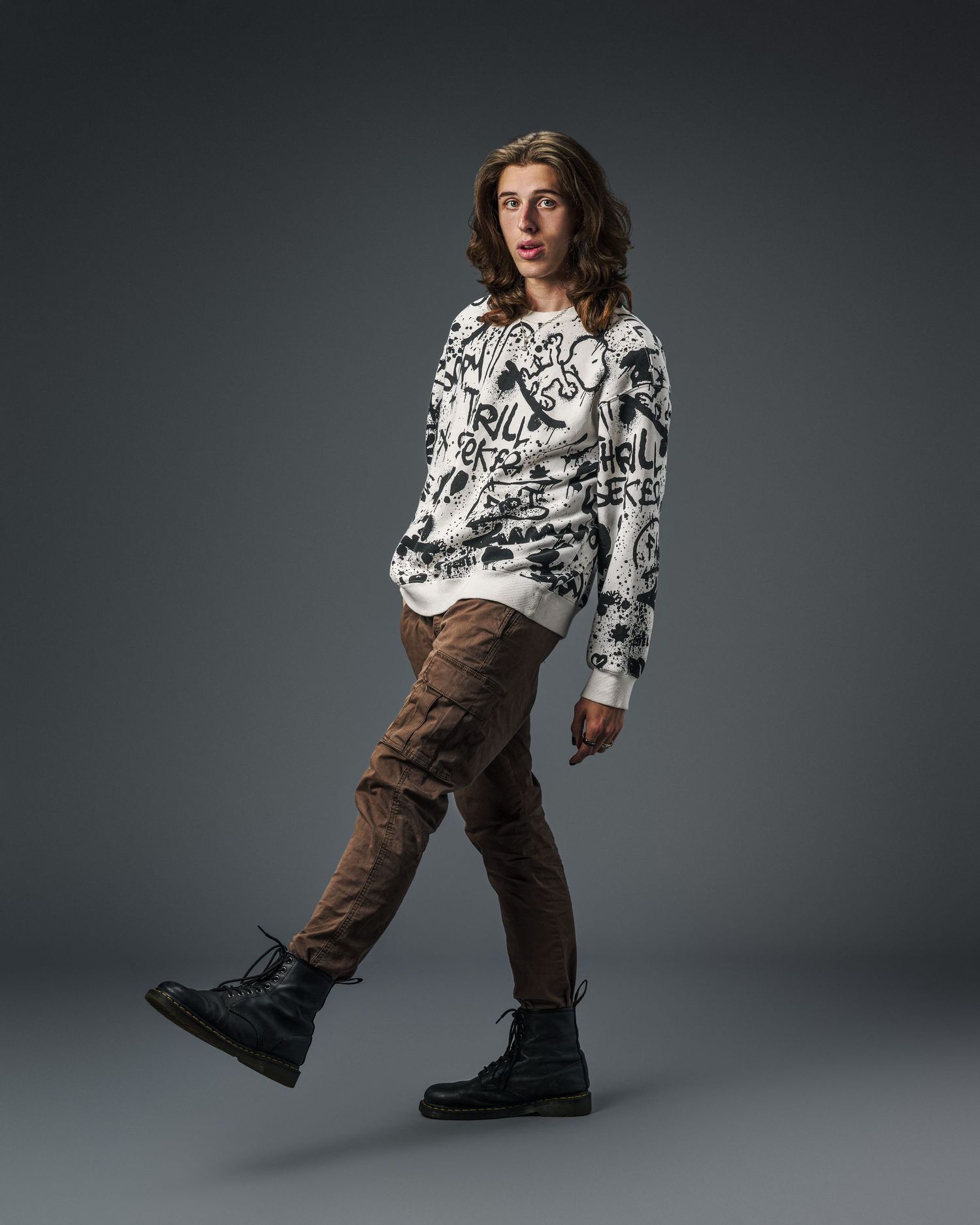 Fashion lookbook series featuring patterned top and brown pants with combat boots against gray backdrop.