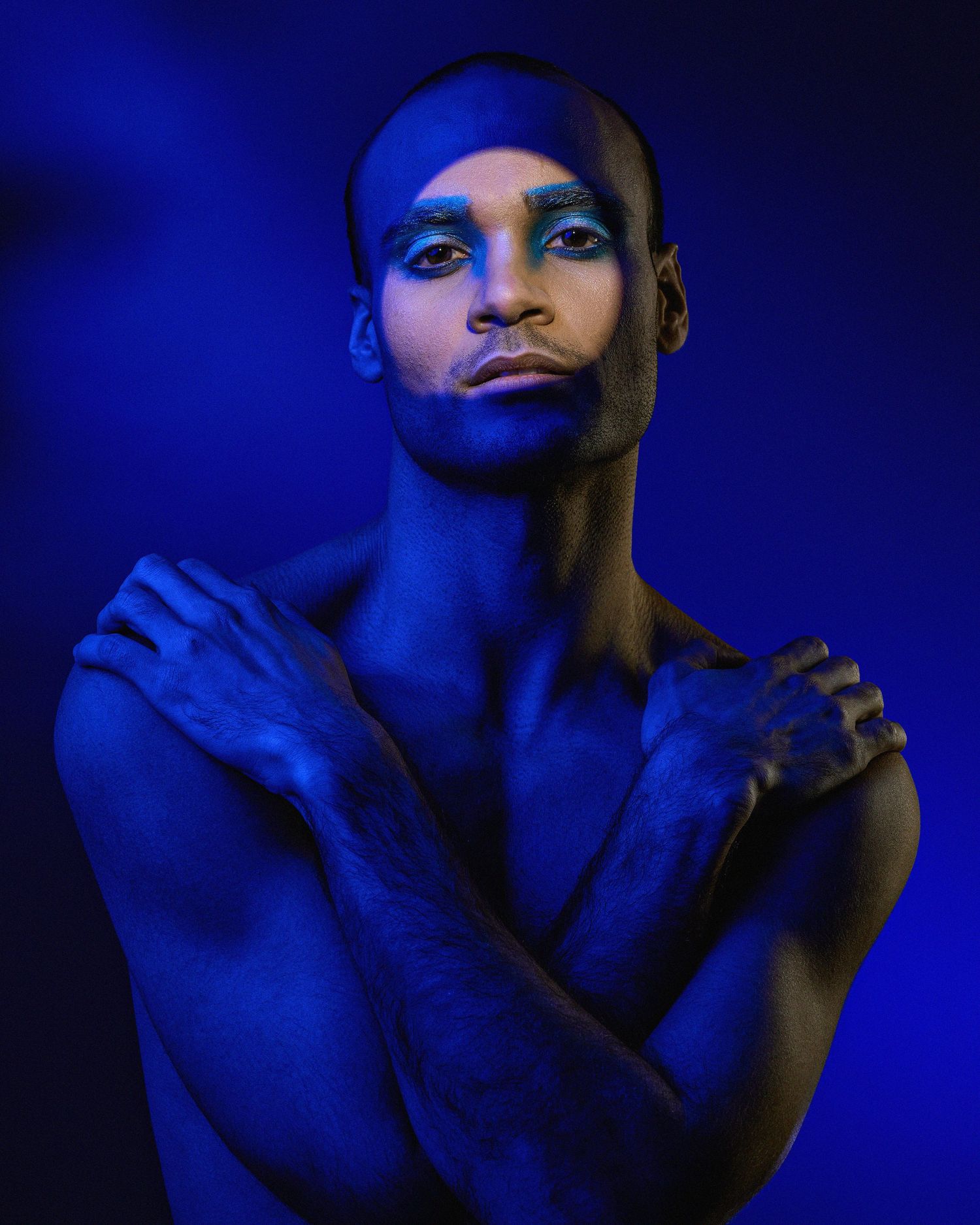 Dramatic blue-lit portraits showing emotional expressions and gestures.