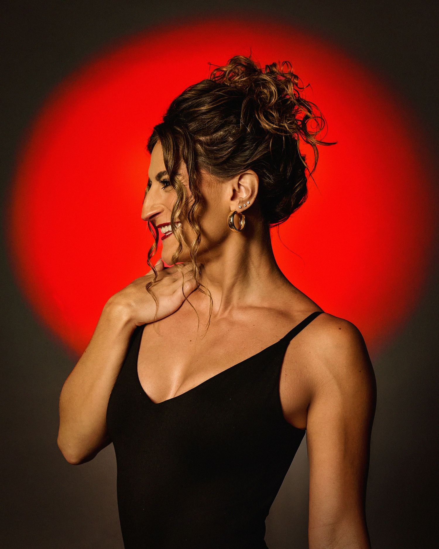 Dramatic portraits against a red background showing dynamic movement and poses.