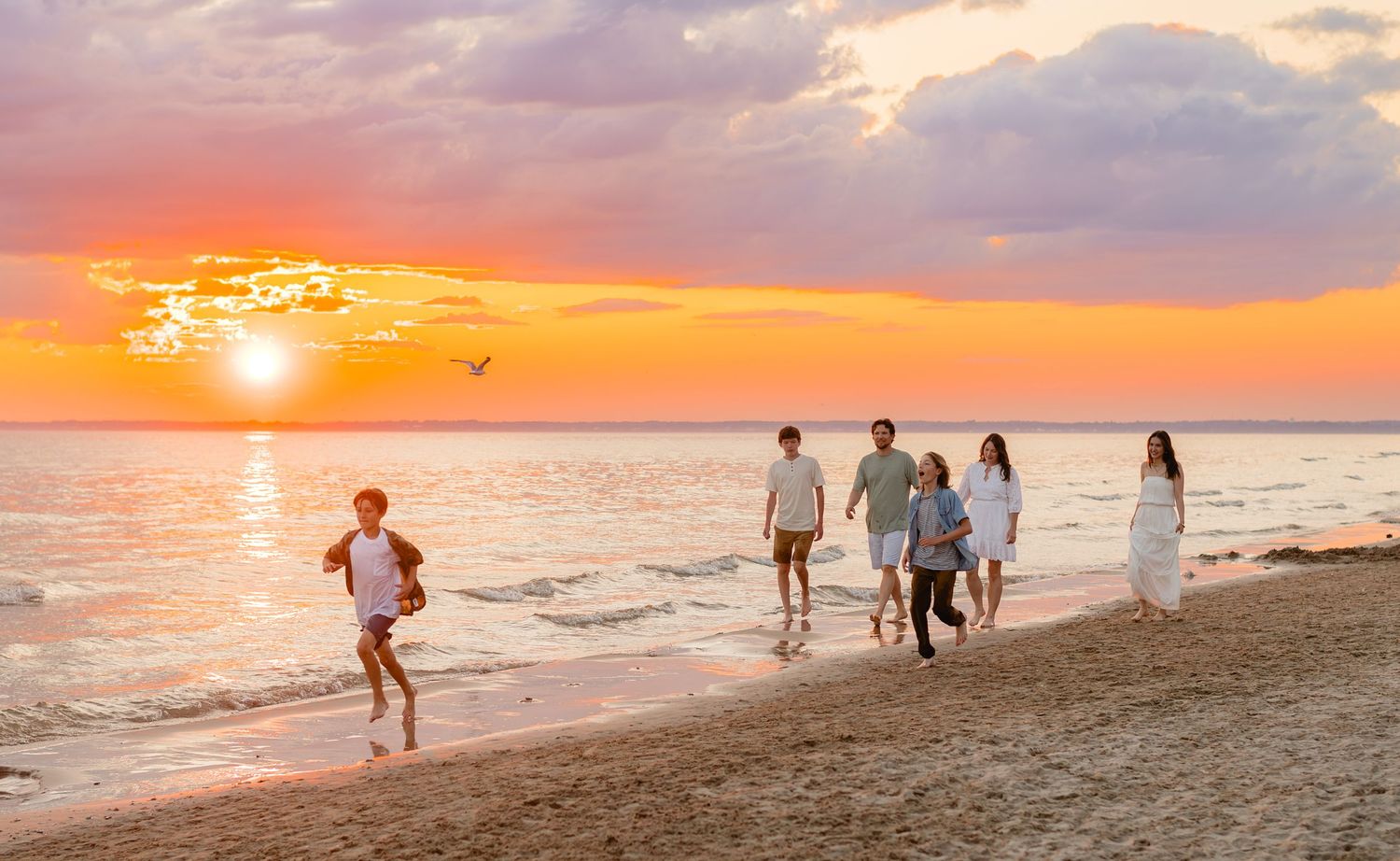 A series of sunset beach scenes showing people silhouetted against vibrant orange and pink skies along the shoreline.