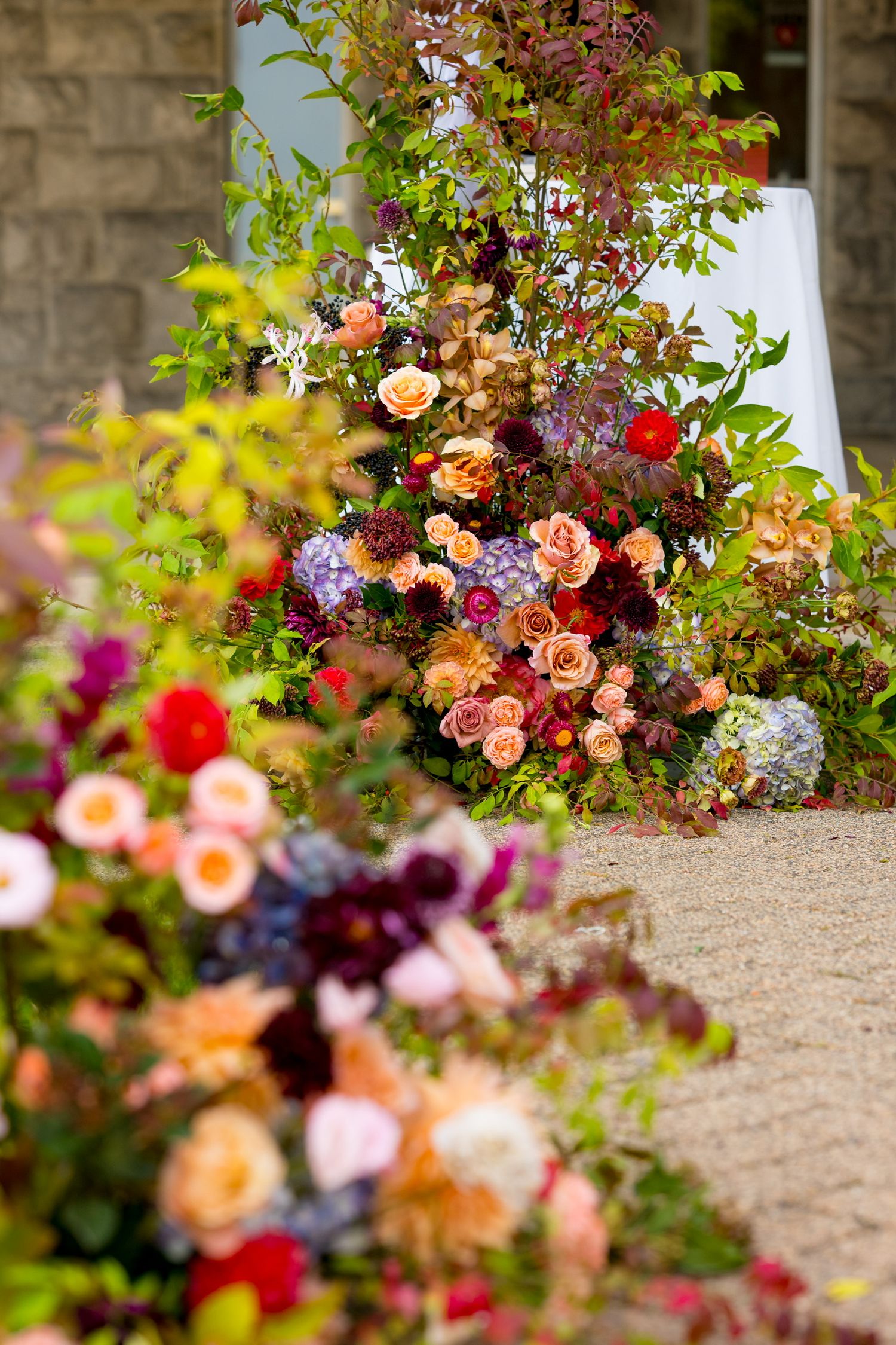 Colorful floral arrangements with roses and wildflowers at Reid Castle in Purchase, New York.