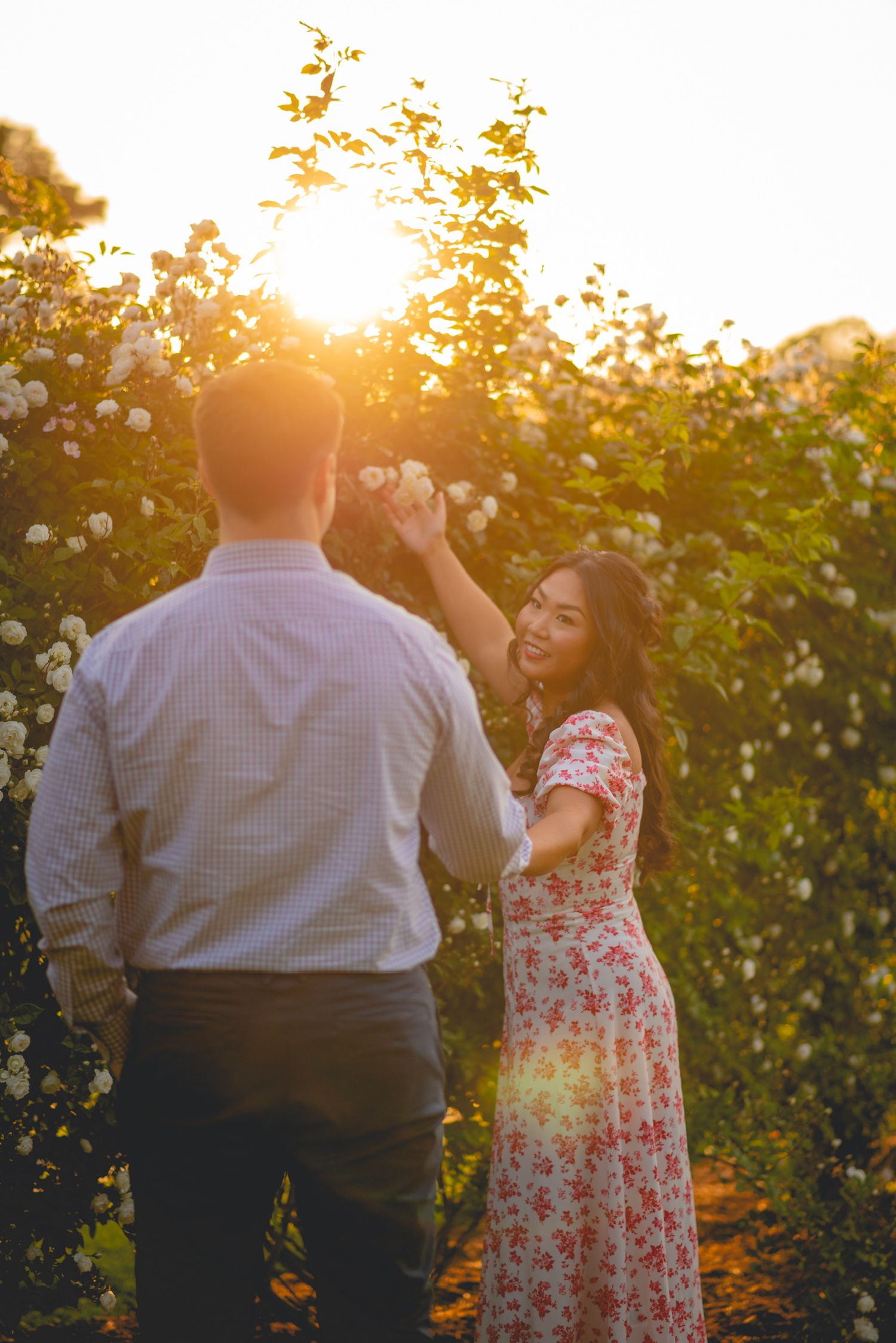 Couple dancing in a garden during golden hour sunset in Connecticut.