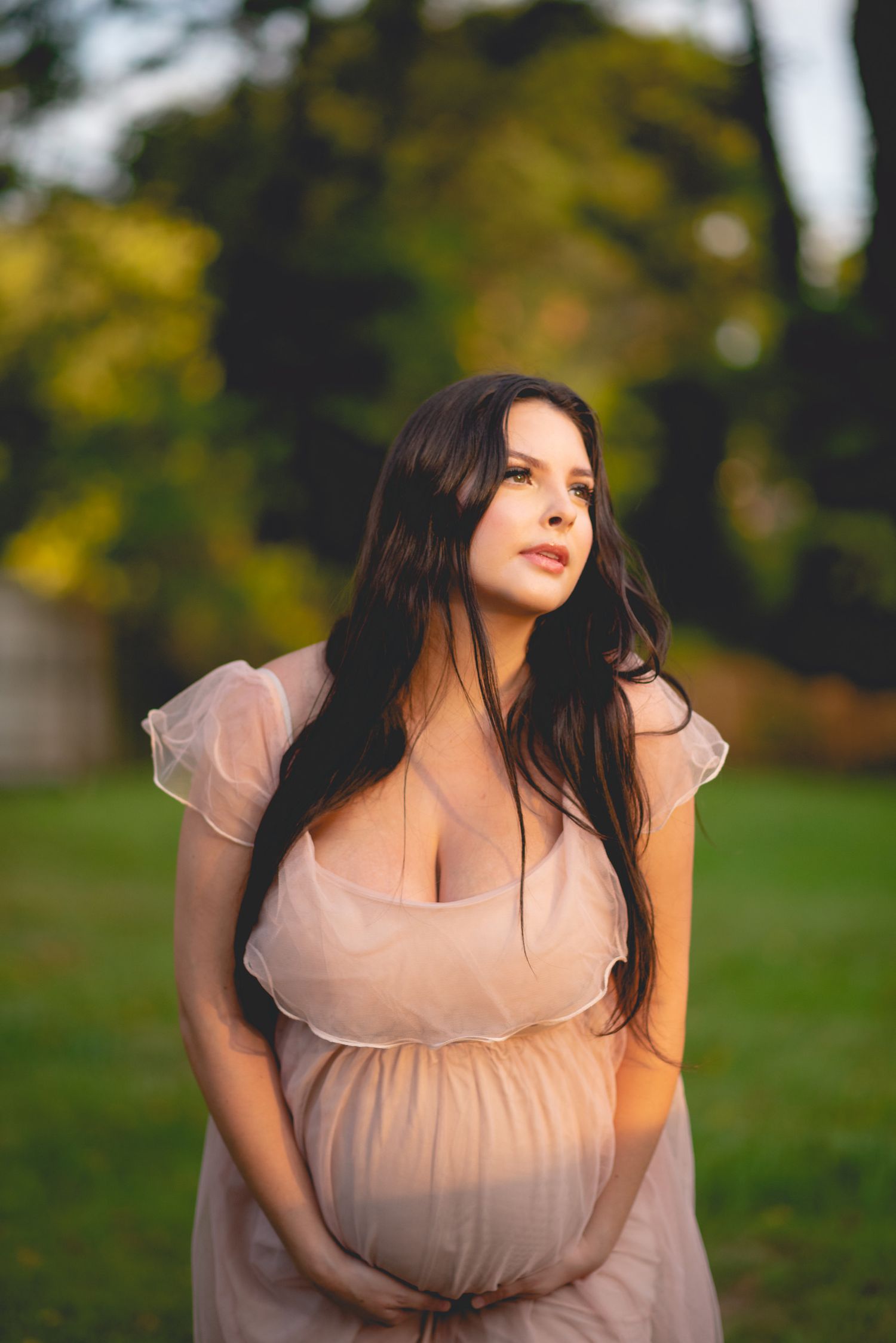 Portrait series in soft natural lighting with autumn foliage in the background.