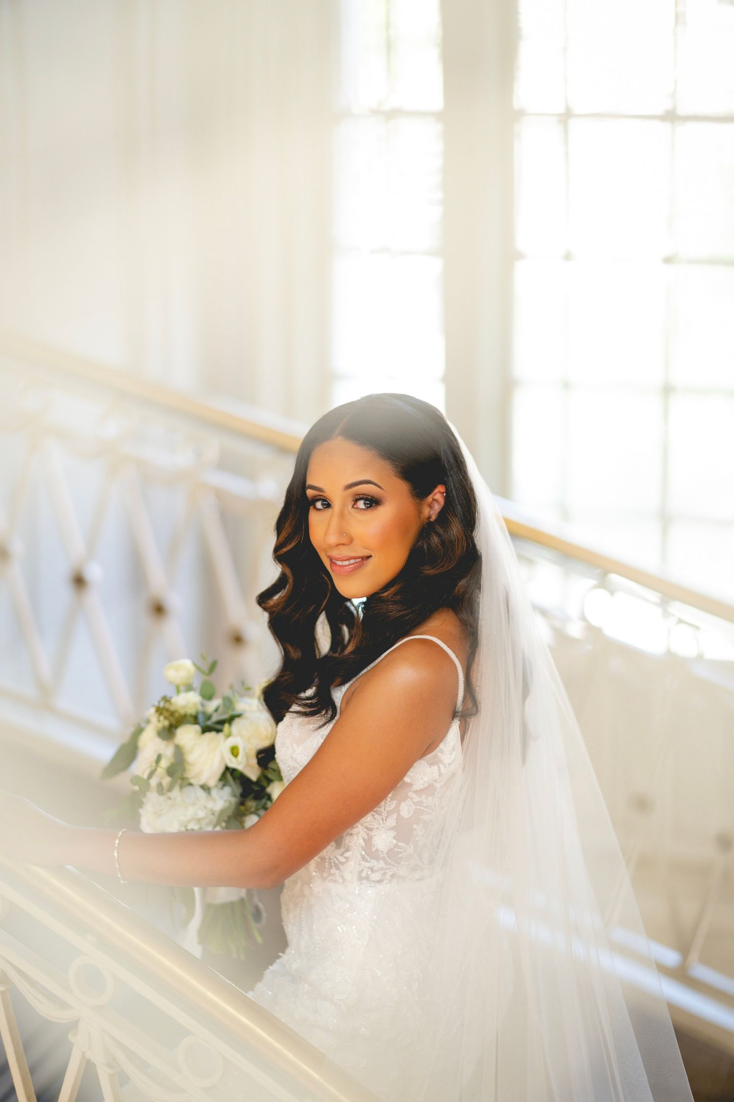Elegant bridal portrait in a sunlit room with white architectural details at Hartford City Hall in Connecticut.