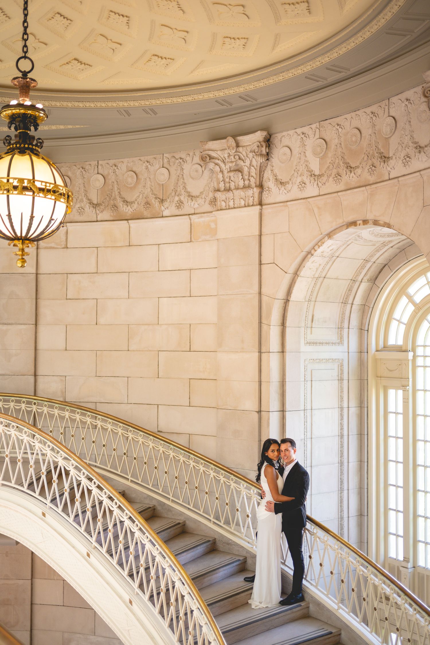 A couple embraces on staircase at Hartford City Hall in Connecticut.