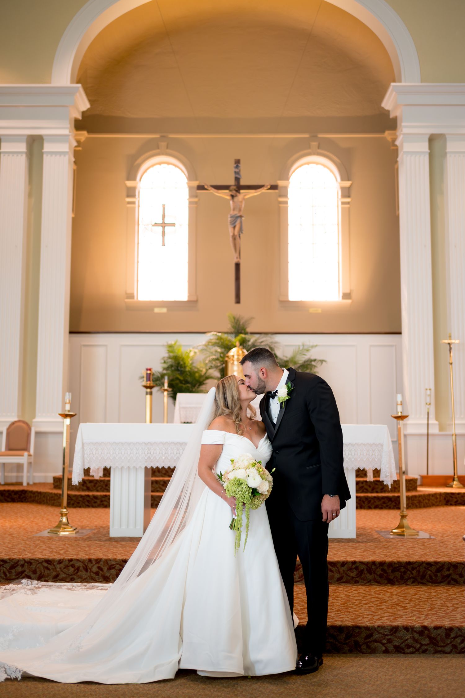 A romantic wedding ceremony sequence showing a couple in a traditional church setting with elegant decor and lighting.