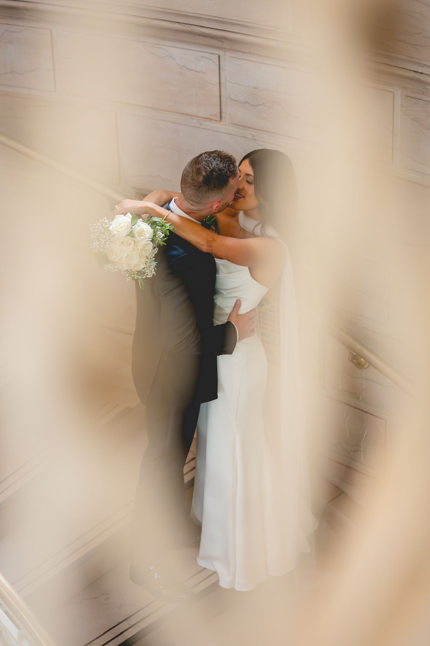 Artistic wedding photos through sheer fabric creating a dreamy effect at Hartford City Hall in Connecticut.