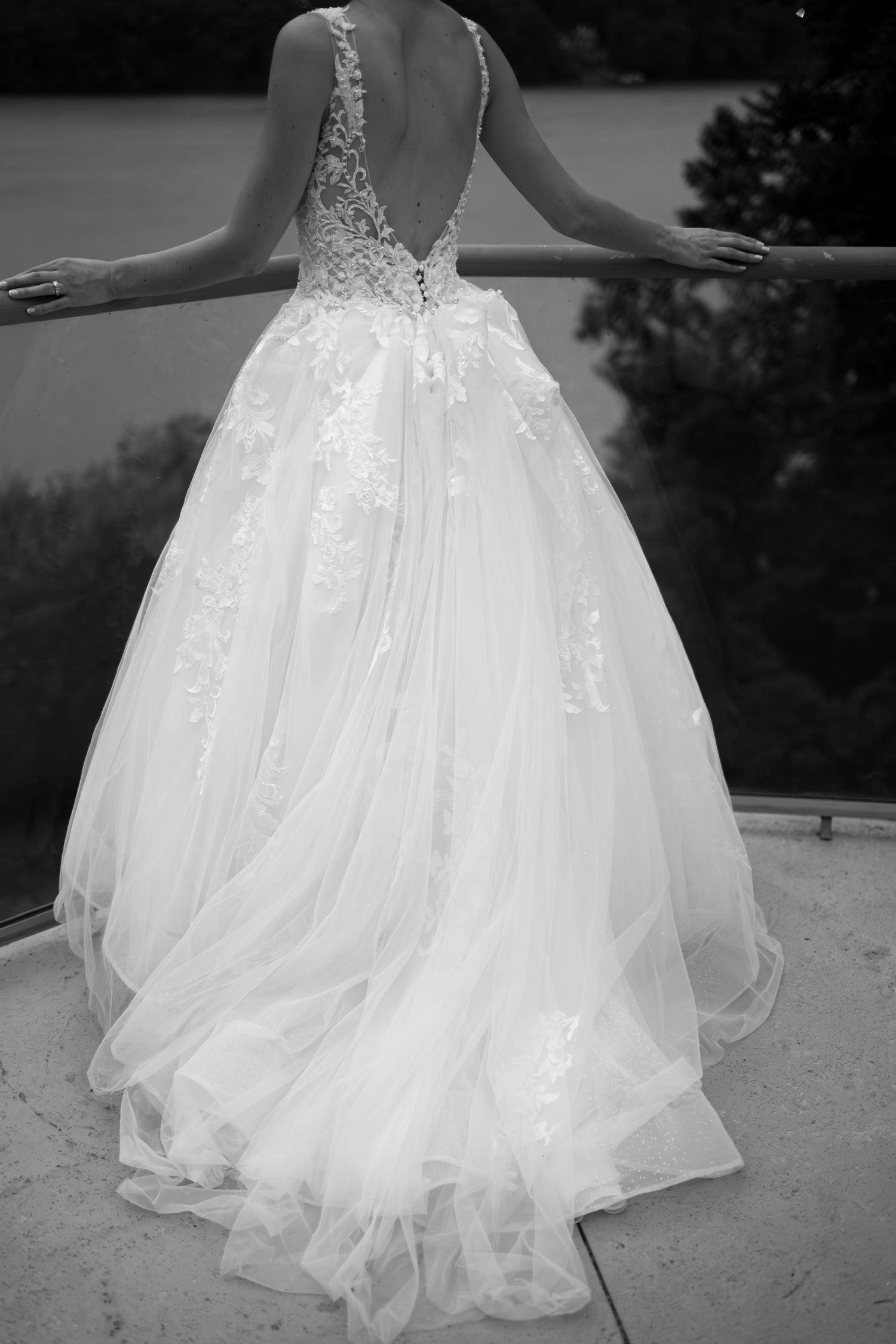 Close-up details of layered tulle wedding dress skirt in black and white.