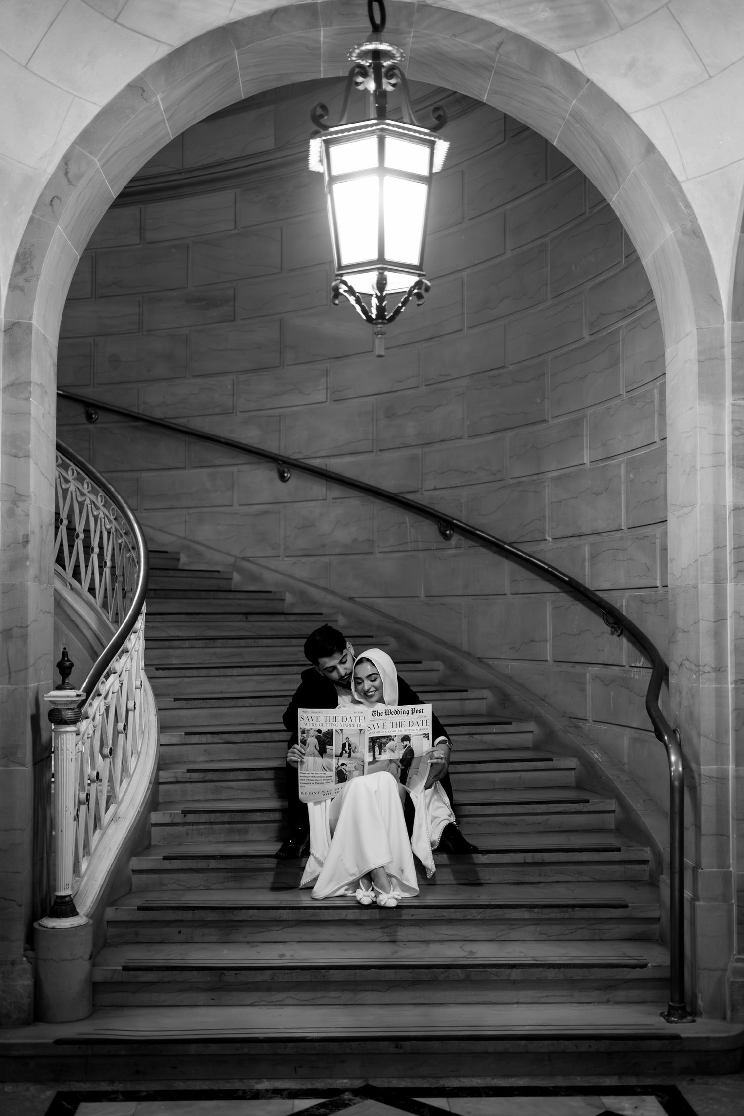 Black and white photo series of a grand arched staircase with hanging lanterns at Hartford City Hall.