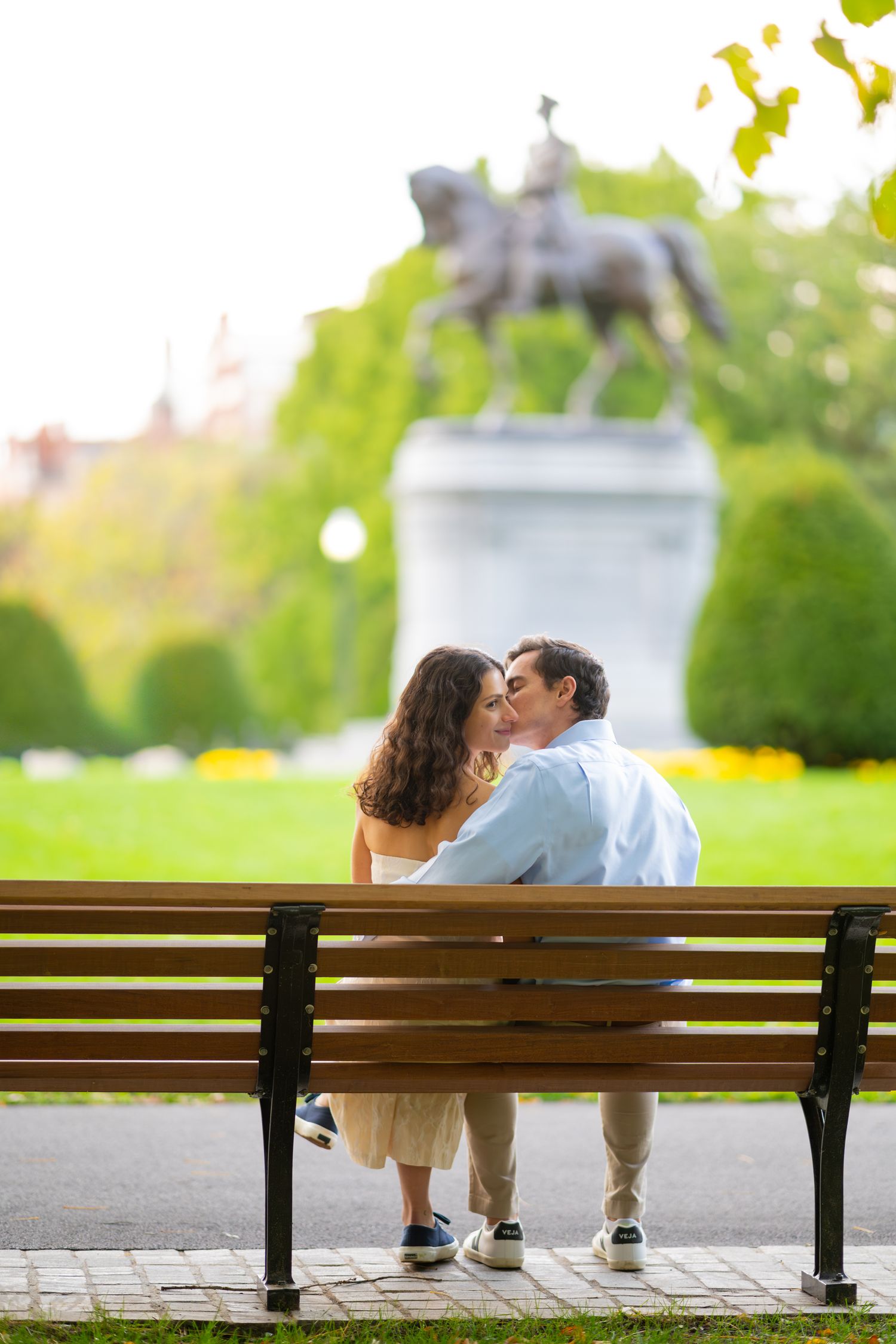 Progressive shots of couple sharing intimate moment on Boston Public Gardens park bench.