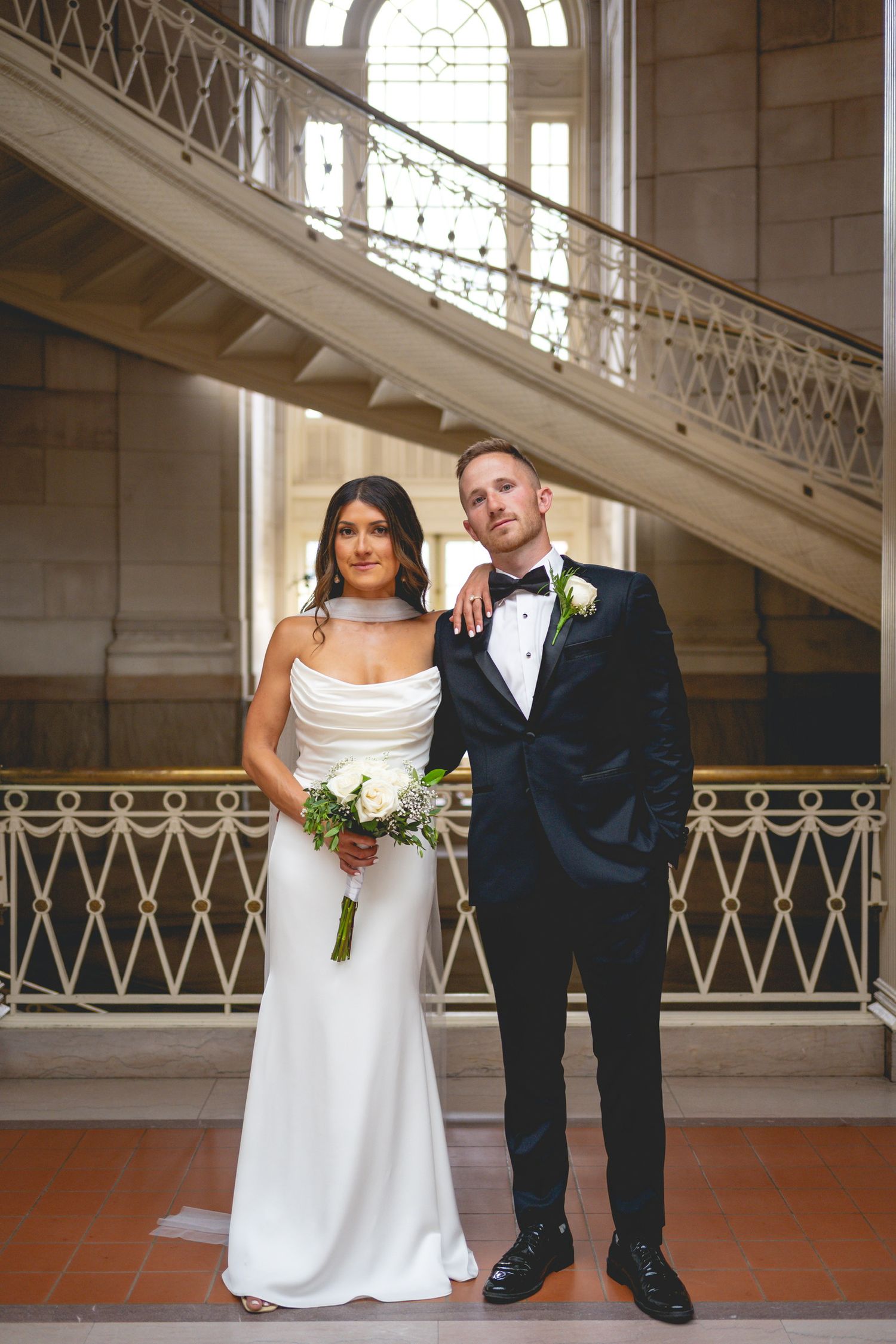 Elegant wedding portraits in a historic building with ornate architectural details at Hartford City Hall in Connecticut.