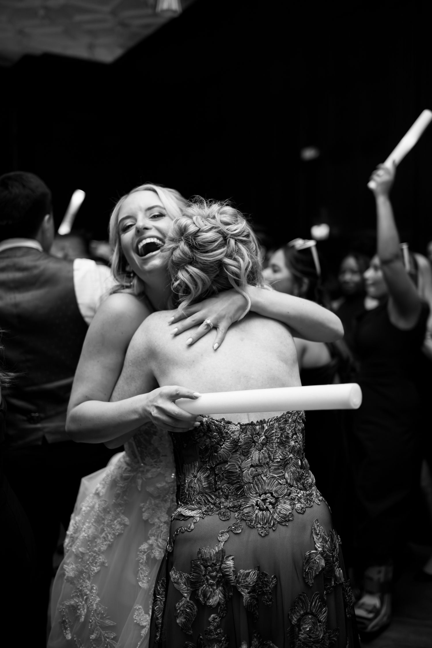 A series of black and white photos showing a person in an elegant dress performing expressive dance movements.