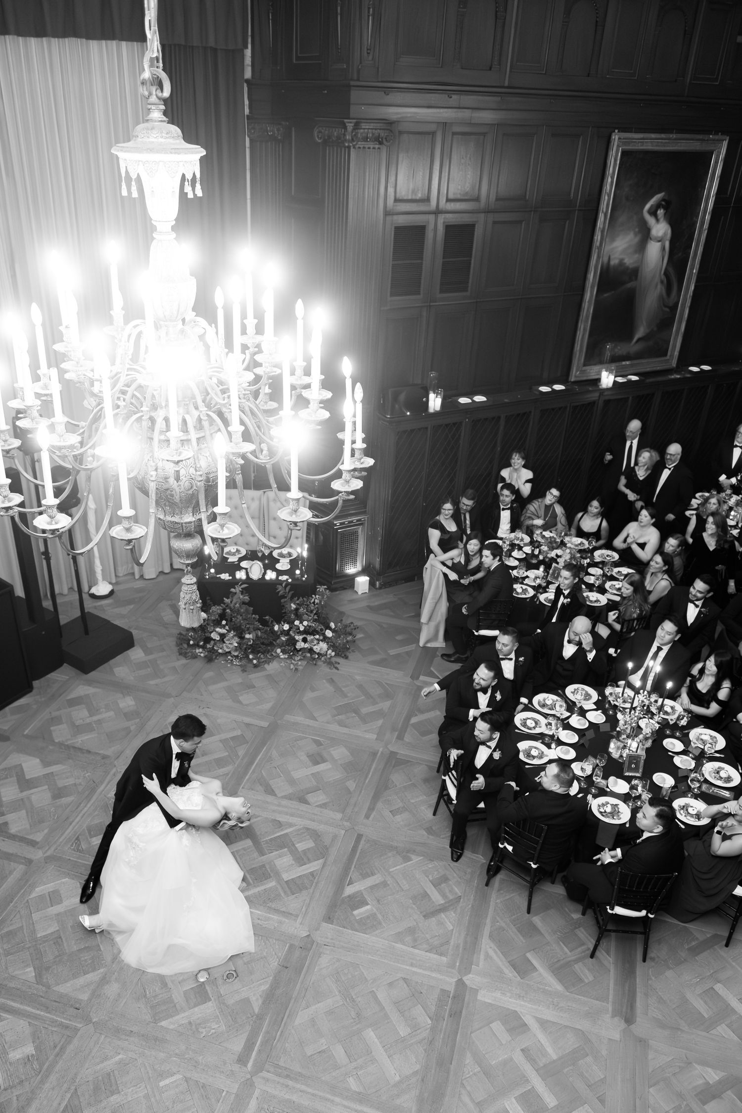 A black and white wedding reception montage shows a couple's first dance under elegant chandeliers in a grand ballroom.