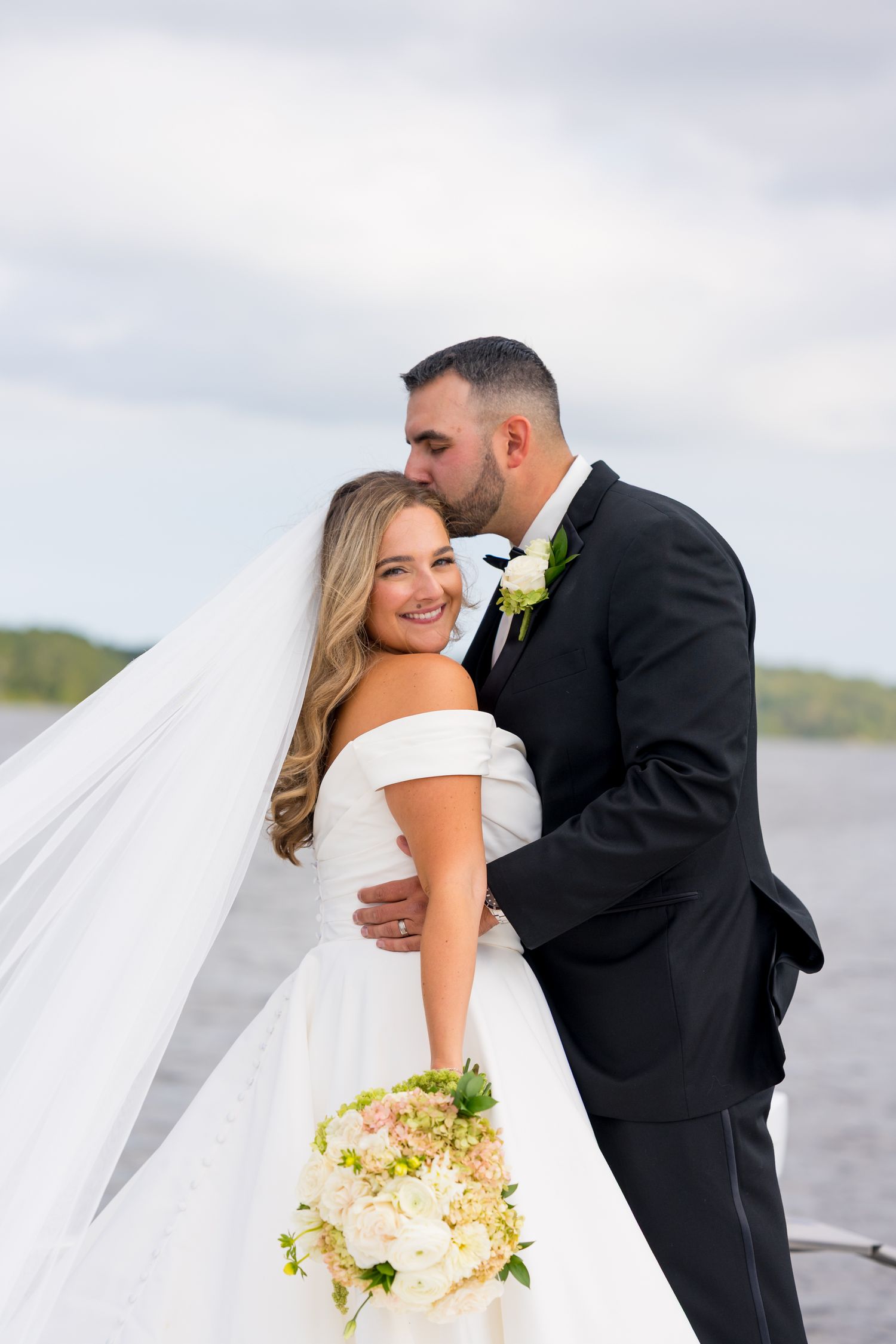 A romantic wedding photo series showing a bride and groom embracing on their special day.