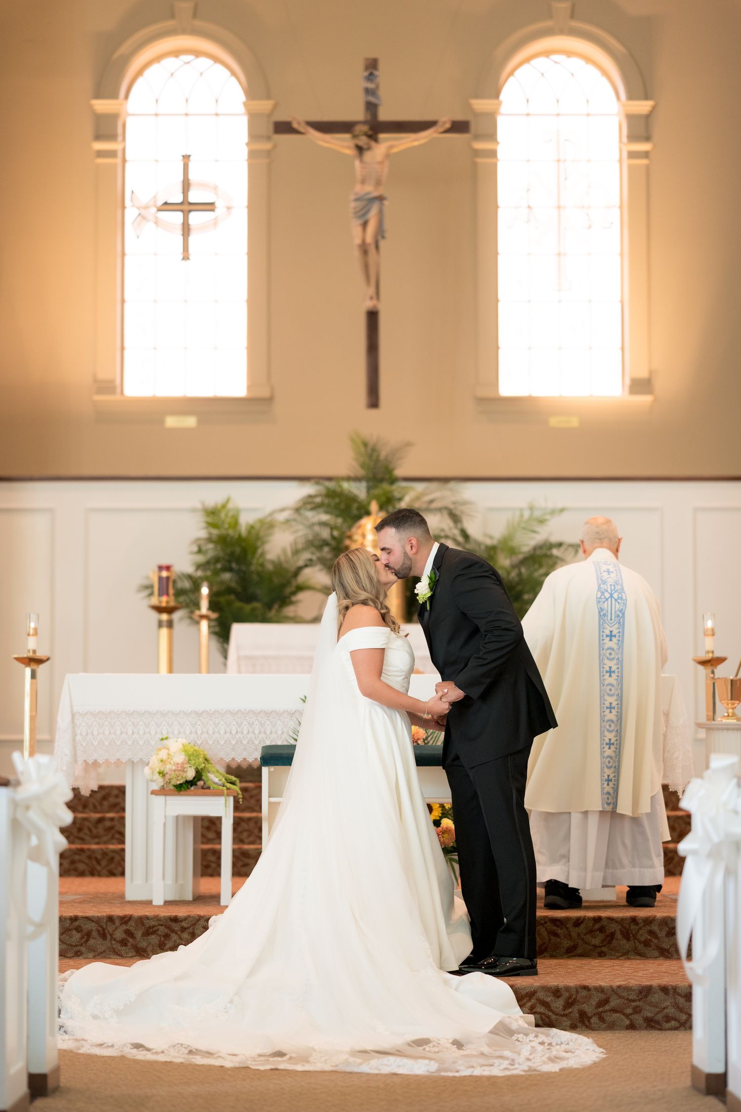 A sequence of five romantic wedding ceremony moments captured inside a traditional church with arched windows.