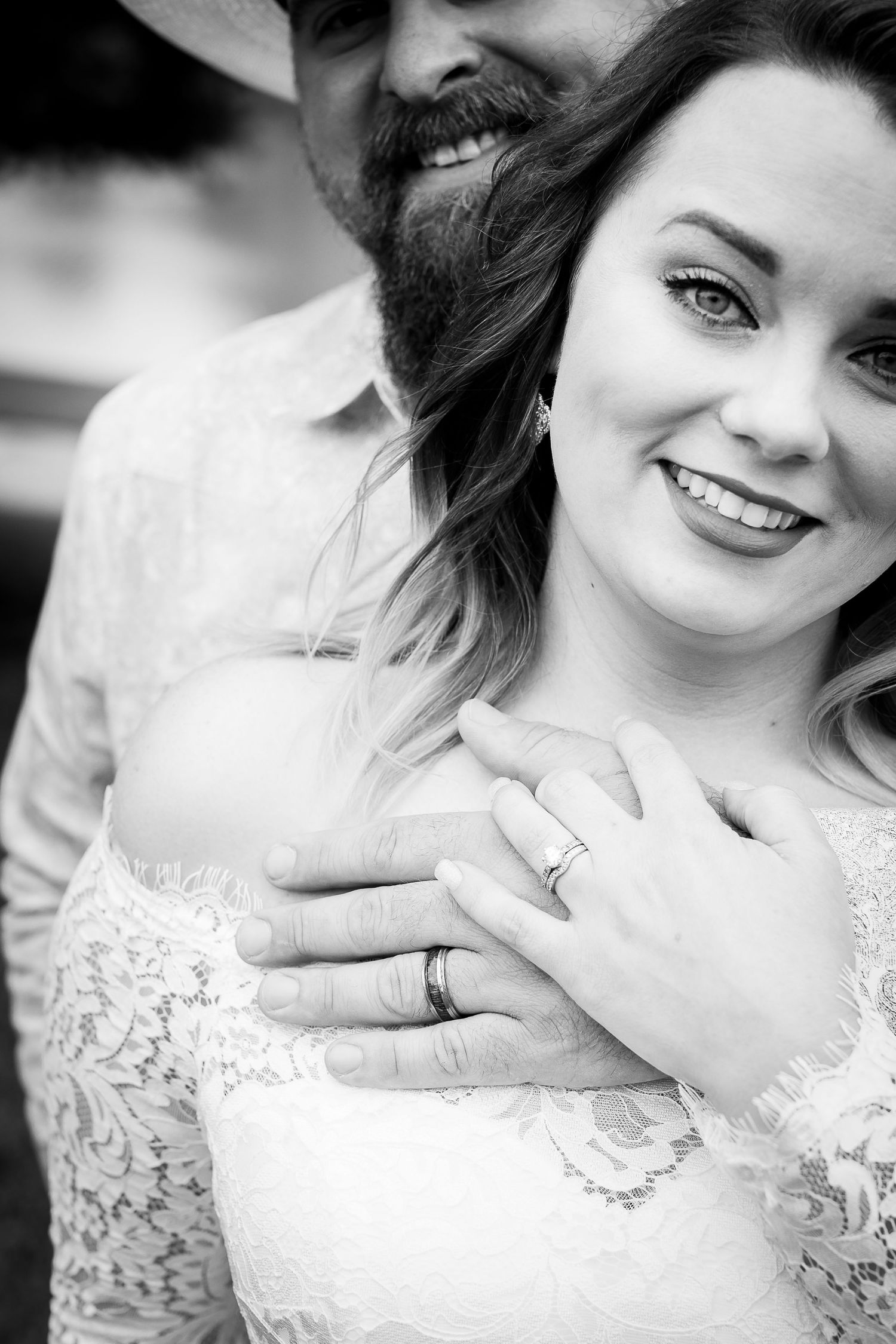 A series of black and white portraits showing someone in a white lace dress with natural, joyful expressions.
