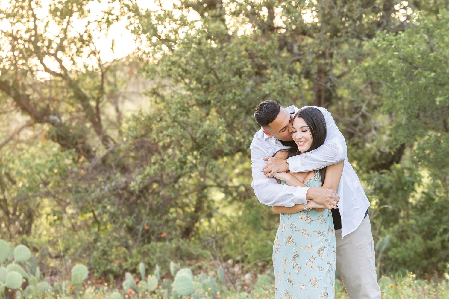 Romantic couples photography session in a natural outdoor setting with soft lighting.