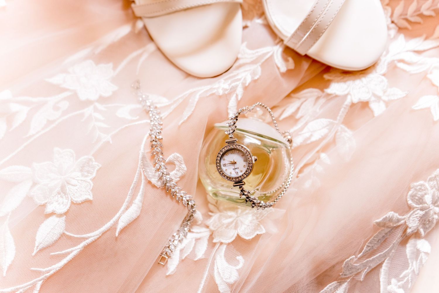 Wedding getting-ready flat lay with slippers, champagne and pink balloons