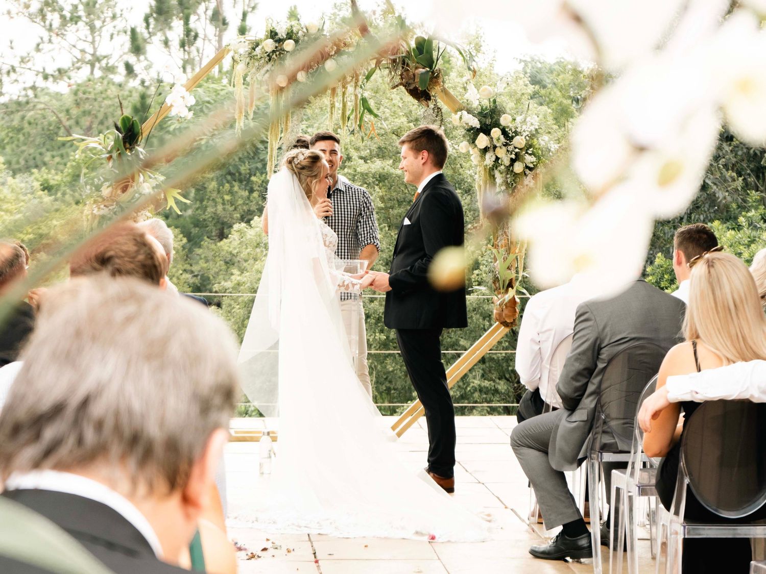 Bride and groom standing at the altar during their outdoor wedding ceremony