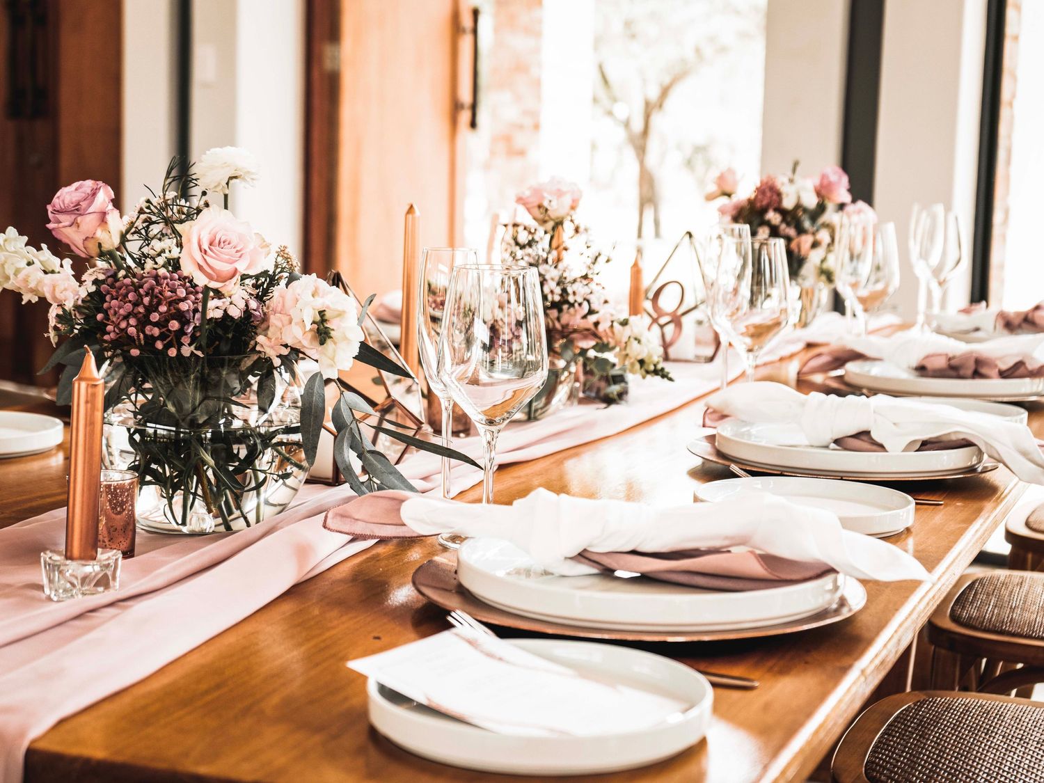Wedding table setting with florals and place settings close-up