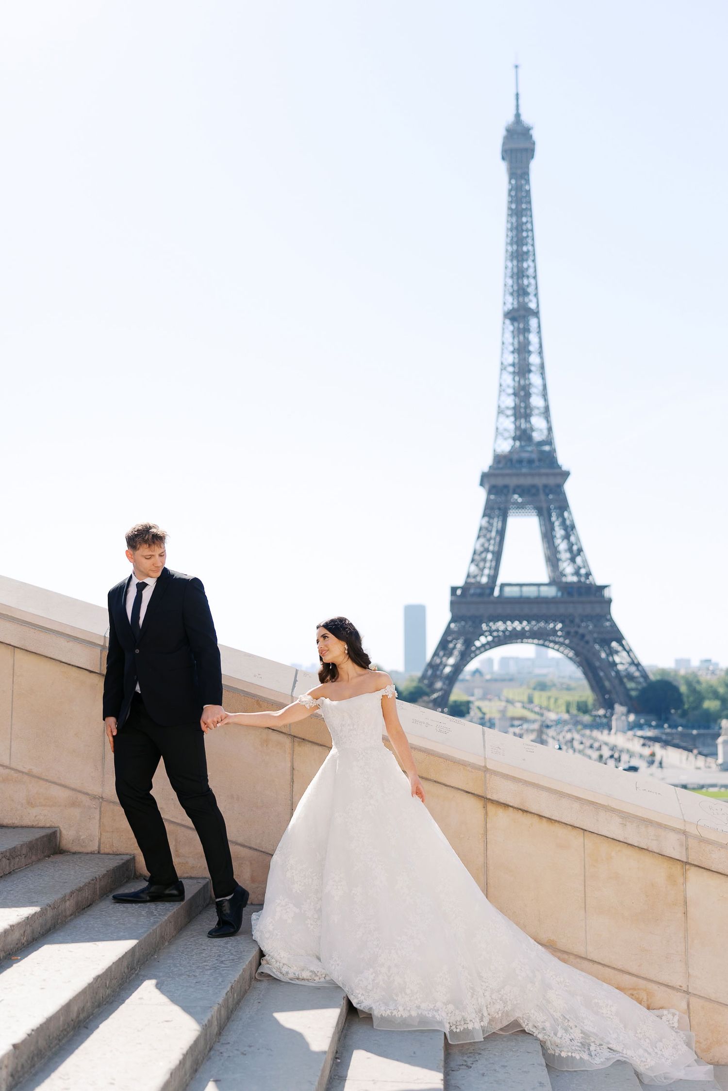 A romantic wedding photoshoot with the iconic Eiffel Tower in Paris creating a stunning backdrop.