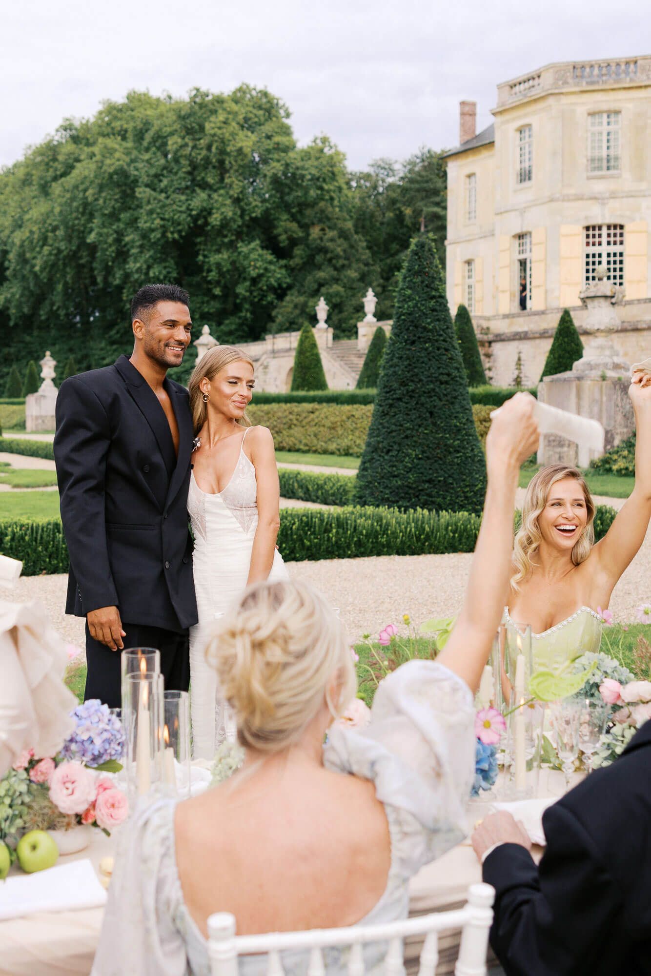 A sequence of wedding celebration photos showing joyful moments at an elegant outdoor venue with a grand mansion backdrop.