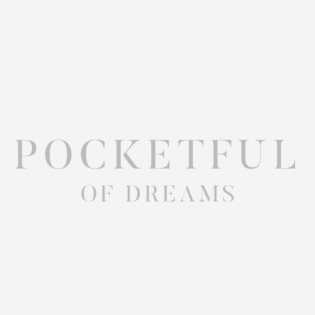 White text reading 'POCKETFUL OF DREAMS' on a light gray background.