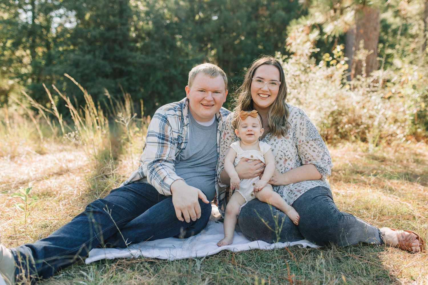 family photo in a field. baby. natural light