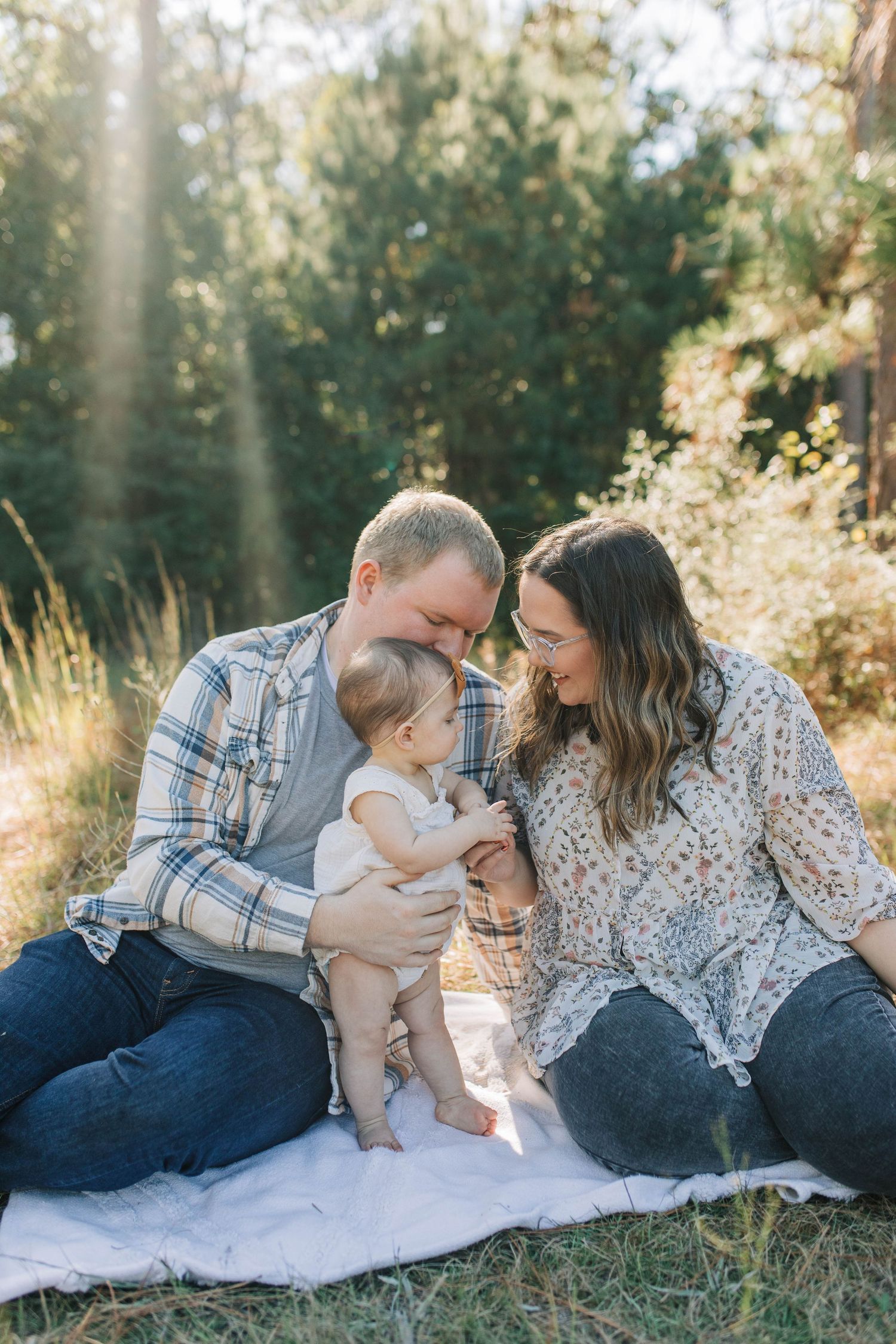 family photo in a field. baby. natural light