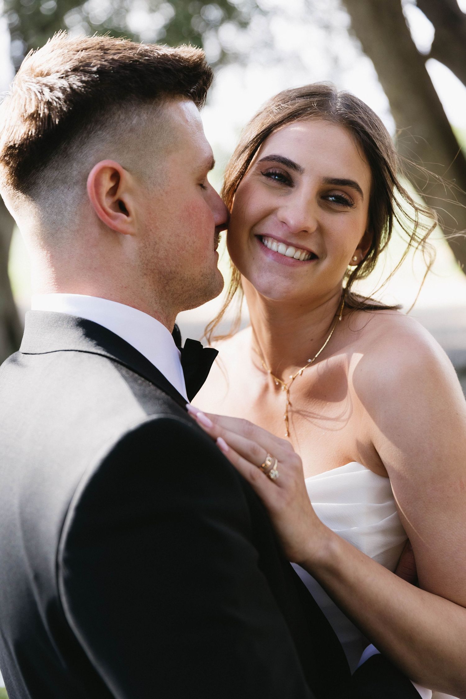Intimate close-up wedding portraits showing tender moments between couple.