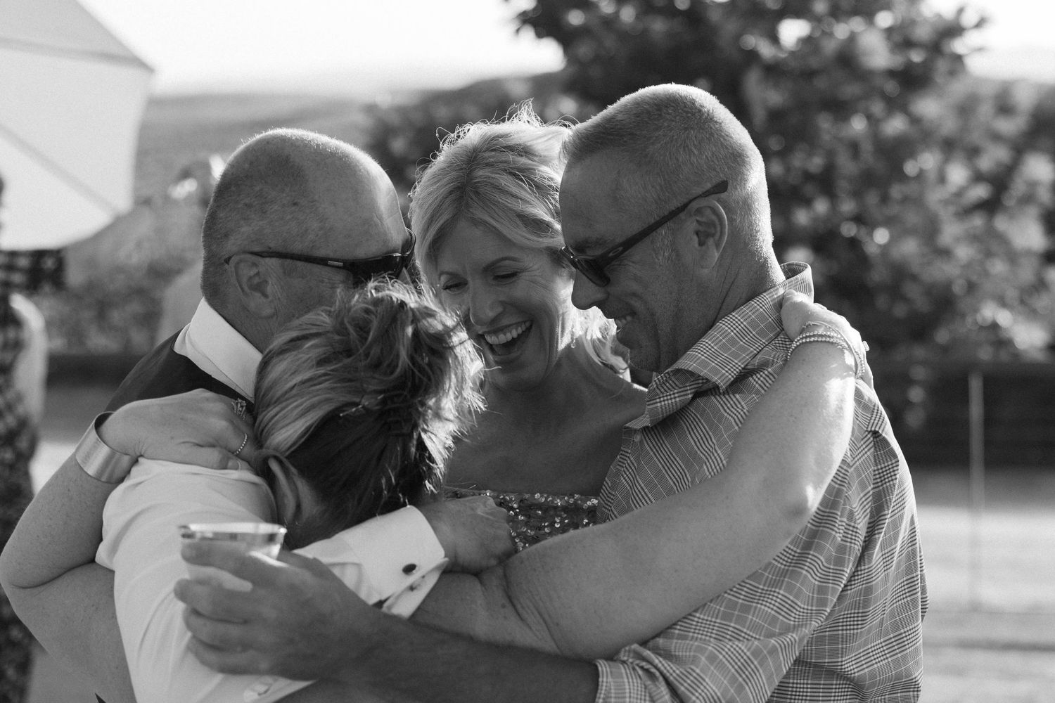 An emotional black and white moment of celebration and embrace.
