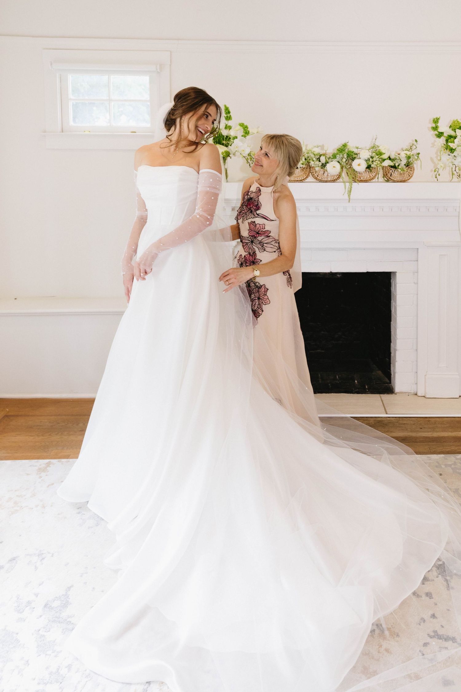 Beautiful wedding dress with long train captured during intimate moment.