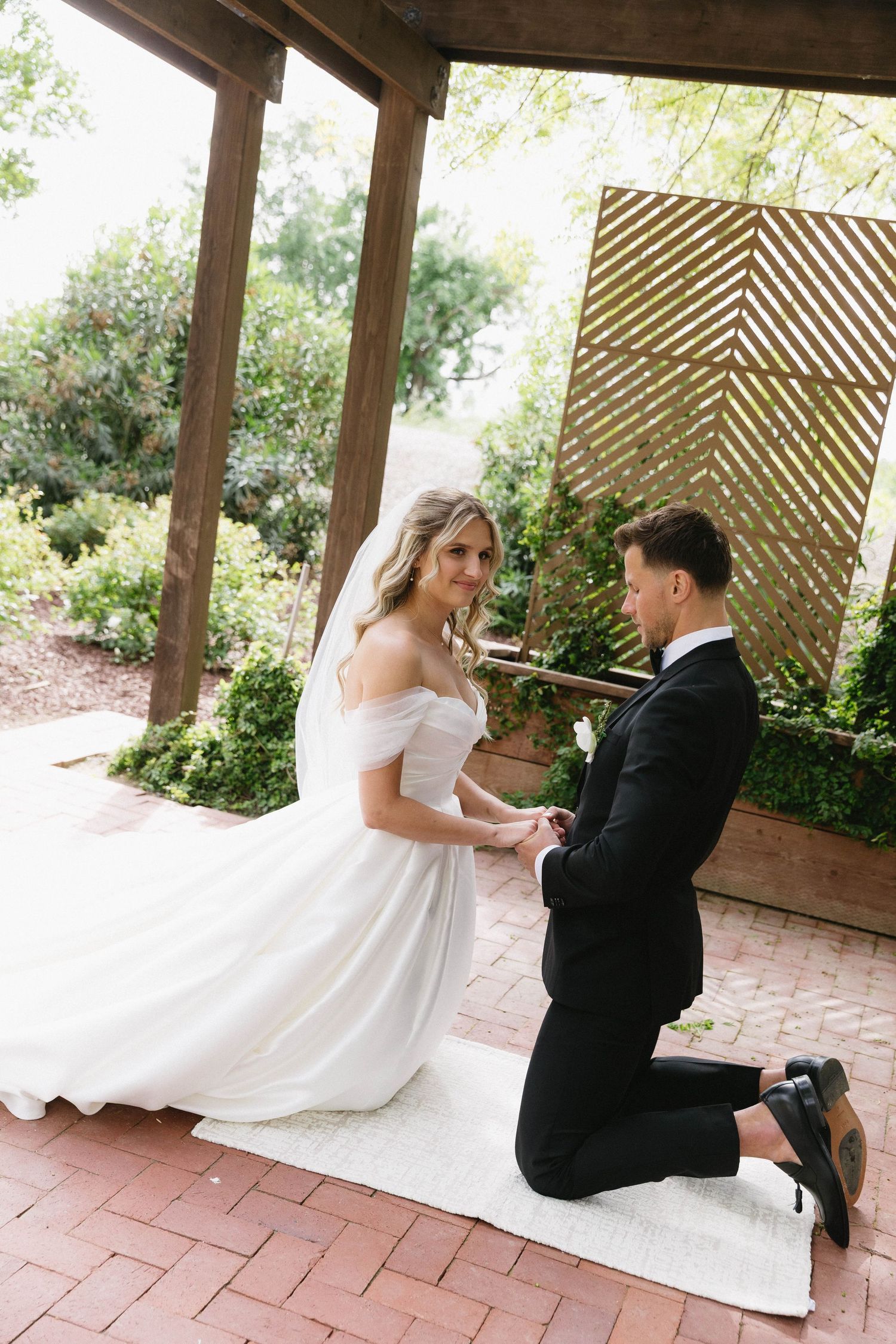 A series of romantic first look photos showing a couple in wedding attire under a wooden pergola.