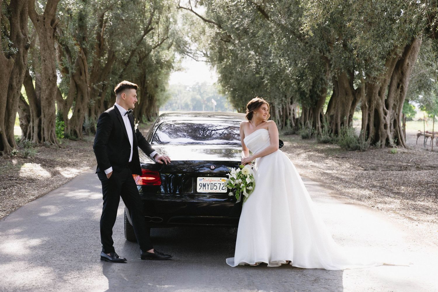 Wedding photoshoot sequence on a rustic path with a black luxury car in the background.