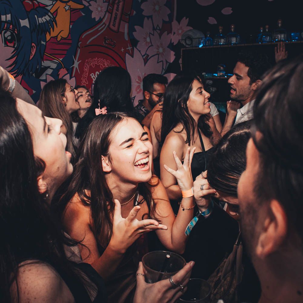 candid photo of people having fun during nightlife party in sydney by sam haber