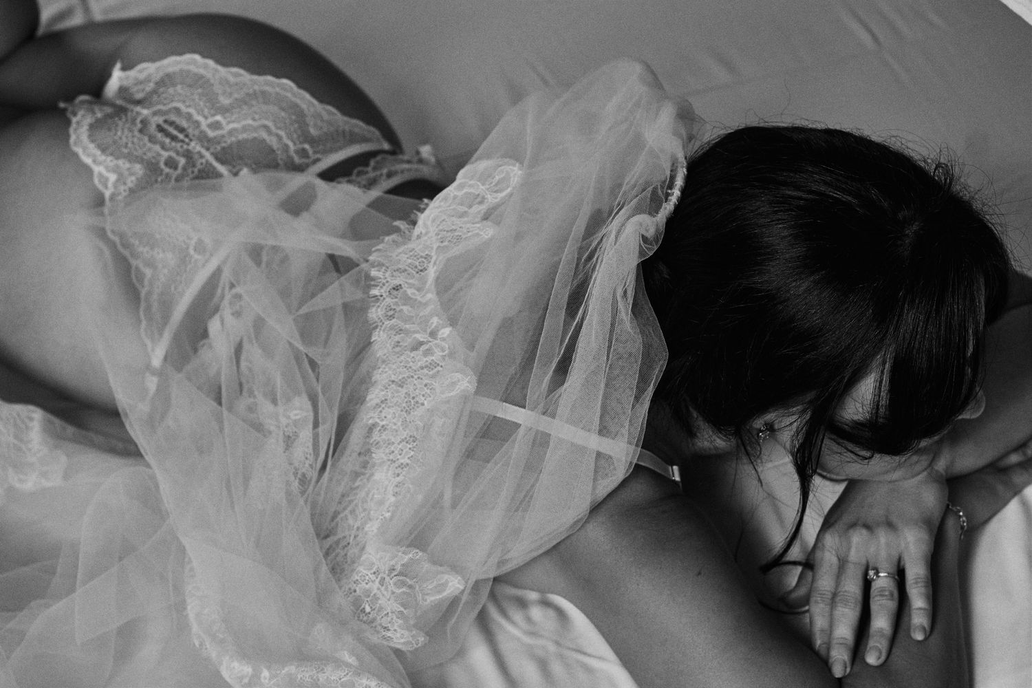 Black and white boudoir photography series with delicate lace and soft lighting.