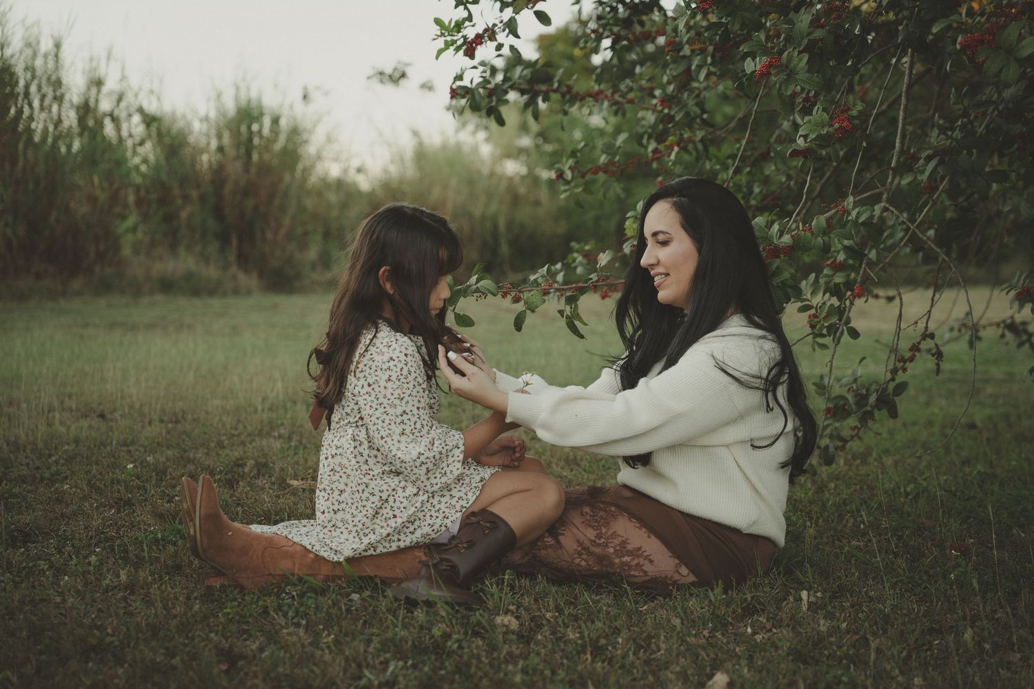 Candid family moments captured in a natural outdoor setting during golden hour.