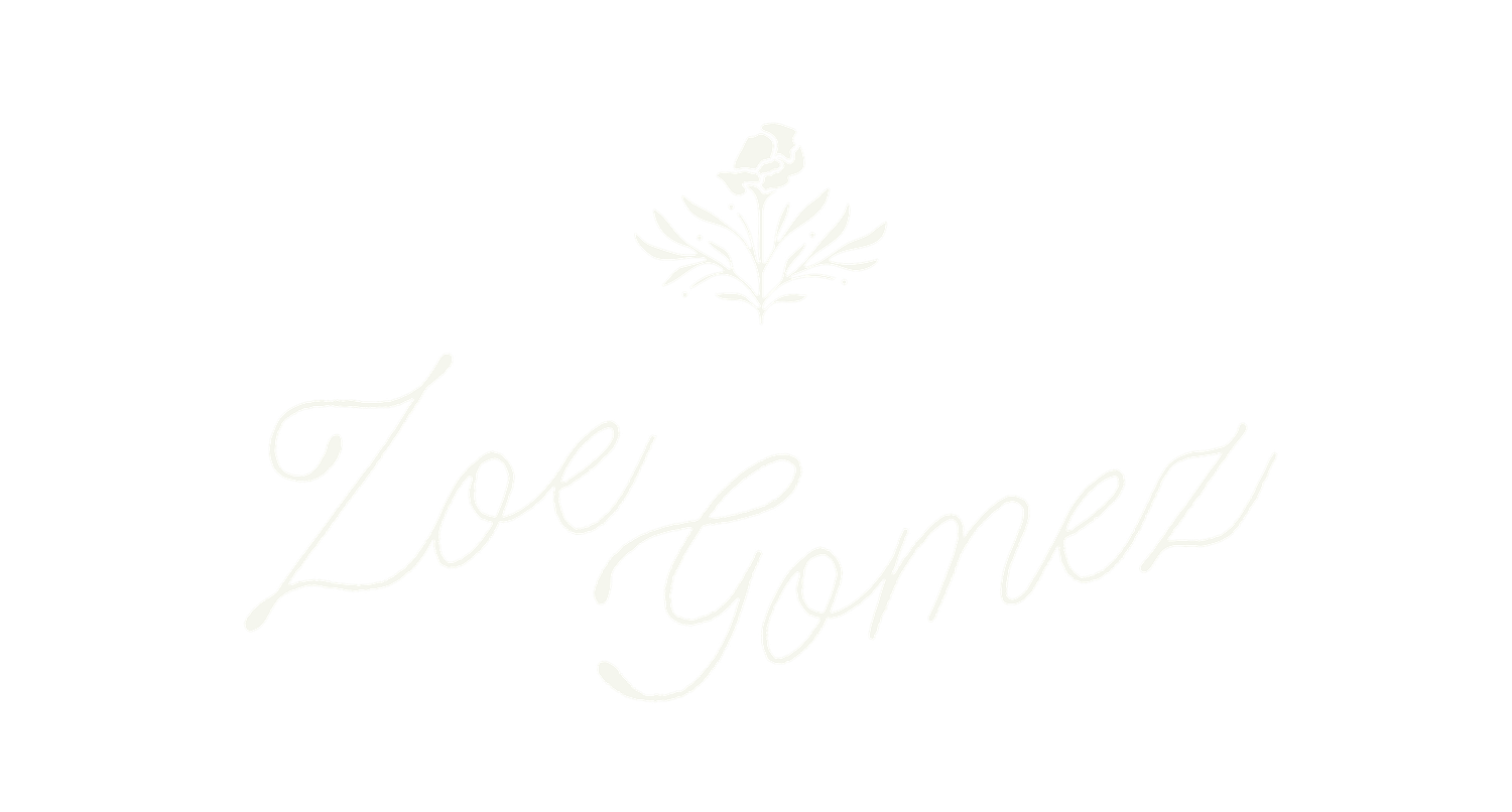 Elegant cursive Zoe Gomez logo with delicate floral emblem on white background.