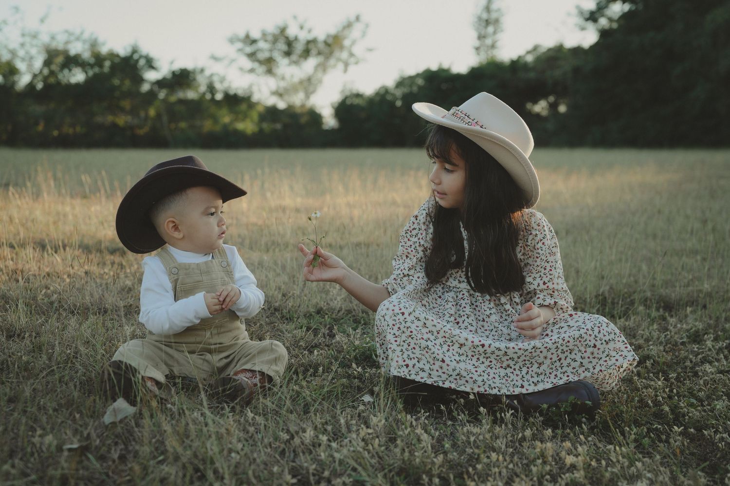Family spending quality time together in a peaceful meadow setting.