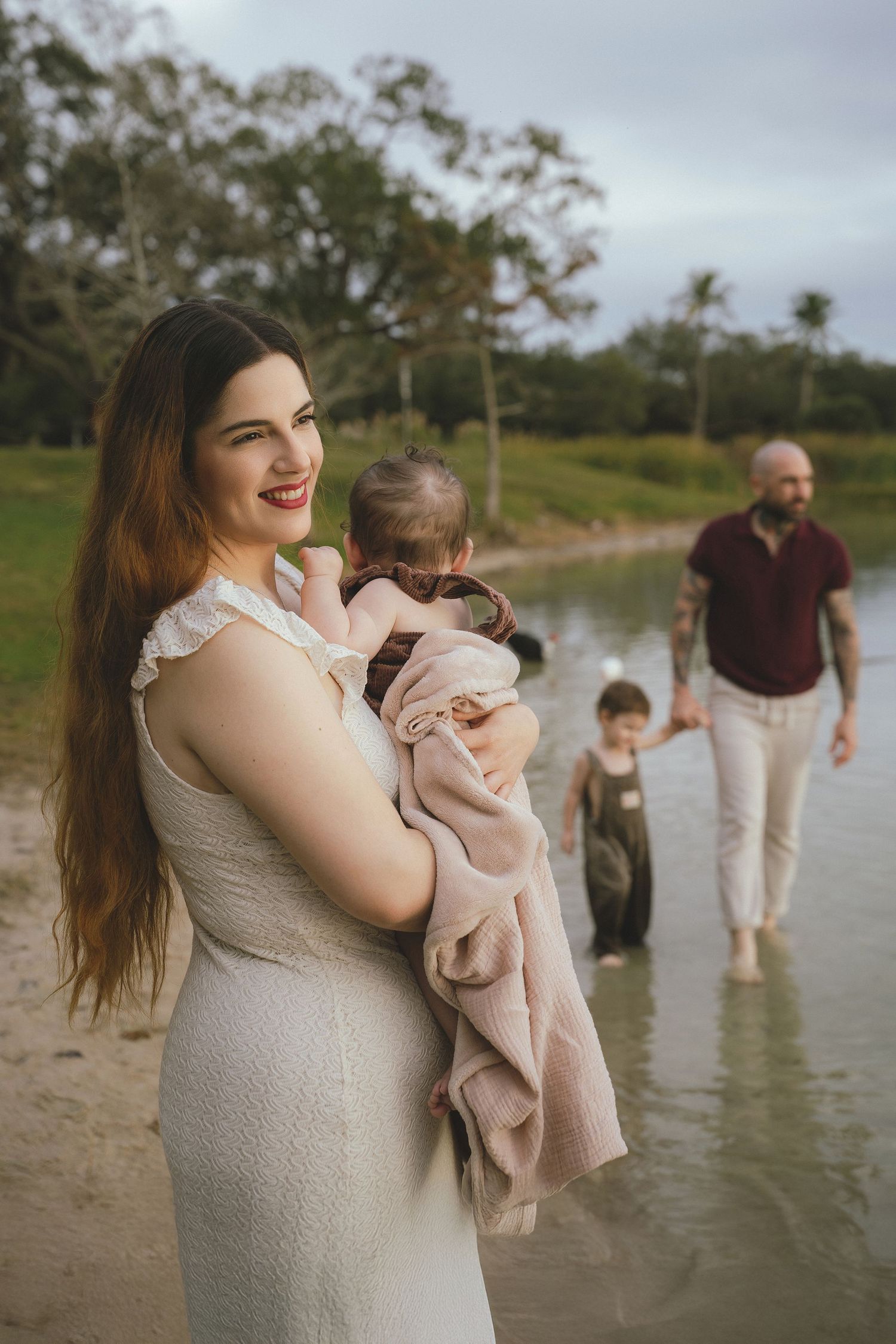 Family enjoying time together at a scenic waterfront location.