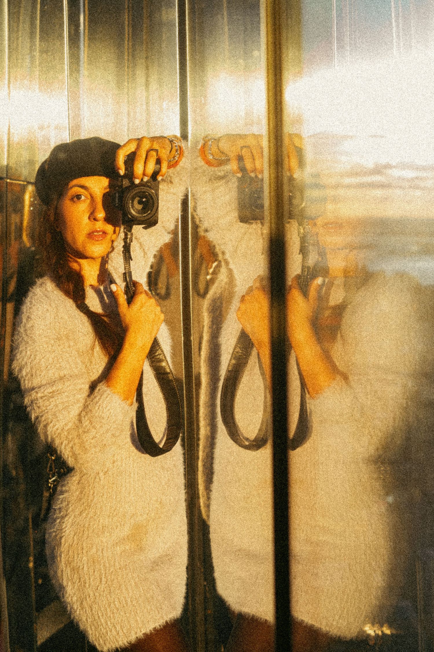 Multiple exposure sequence showing reflections through glass with warm tones.