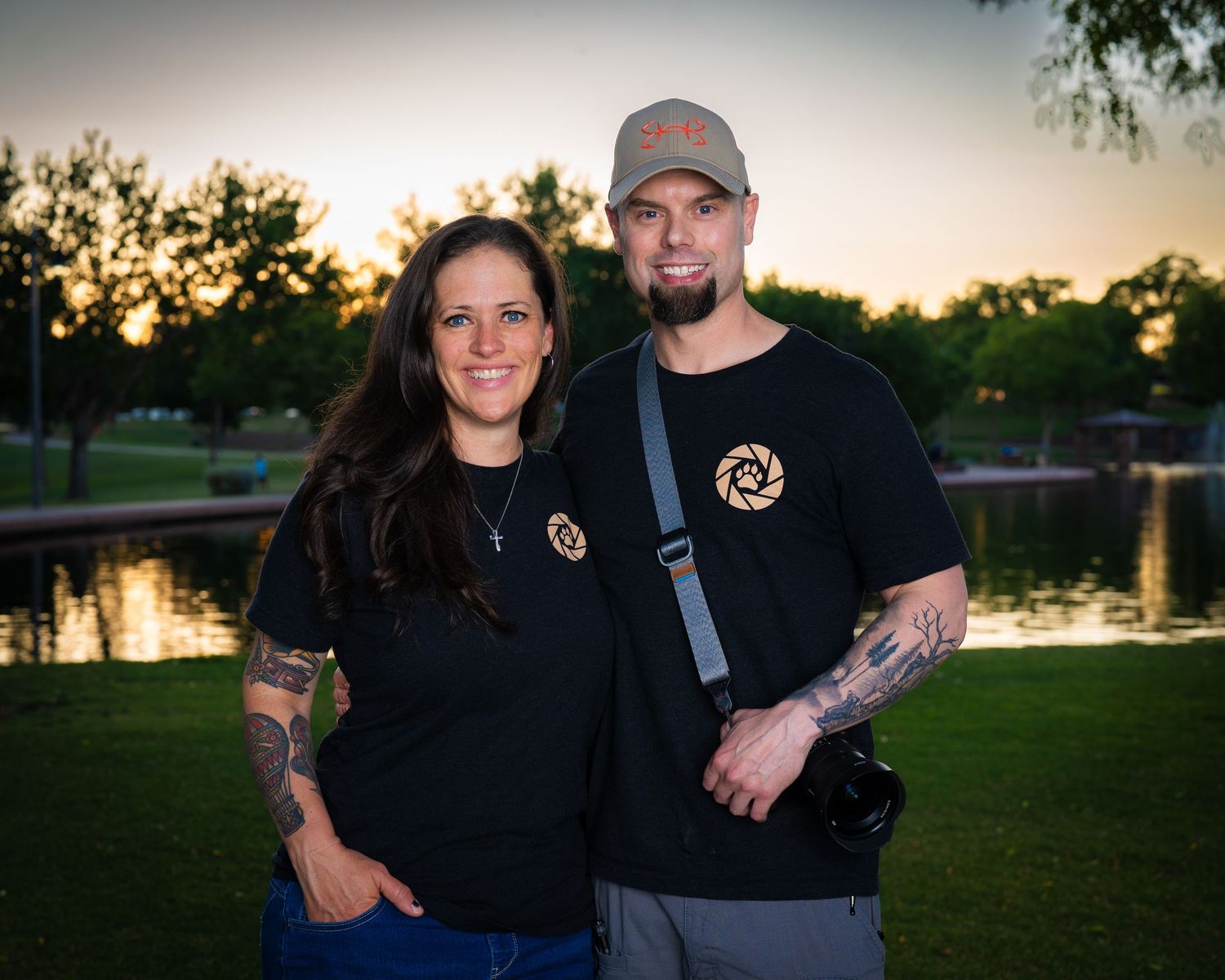 Brian and Kathy Farrelly, the founders of Dog Days Pet Photography, posing for an outdoor portrait at sunset.