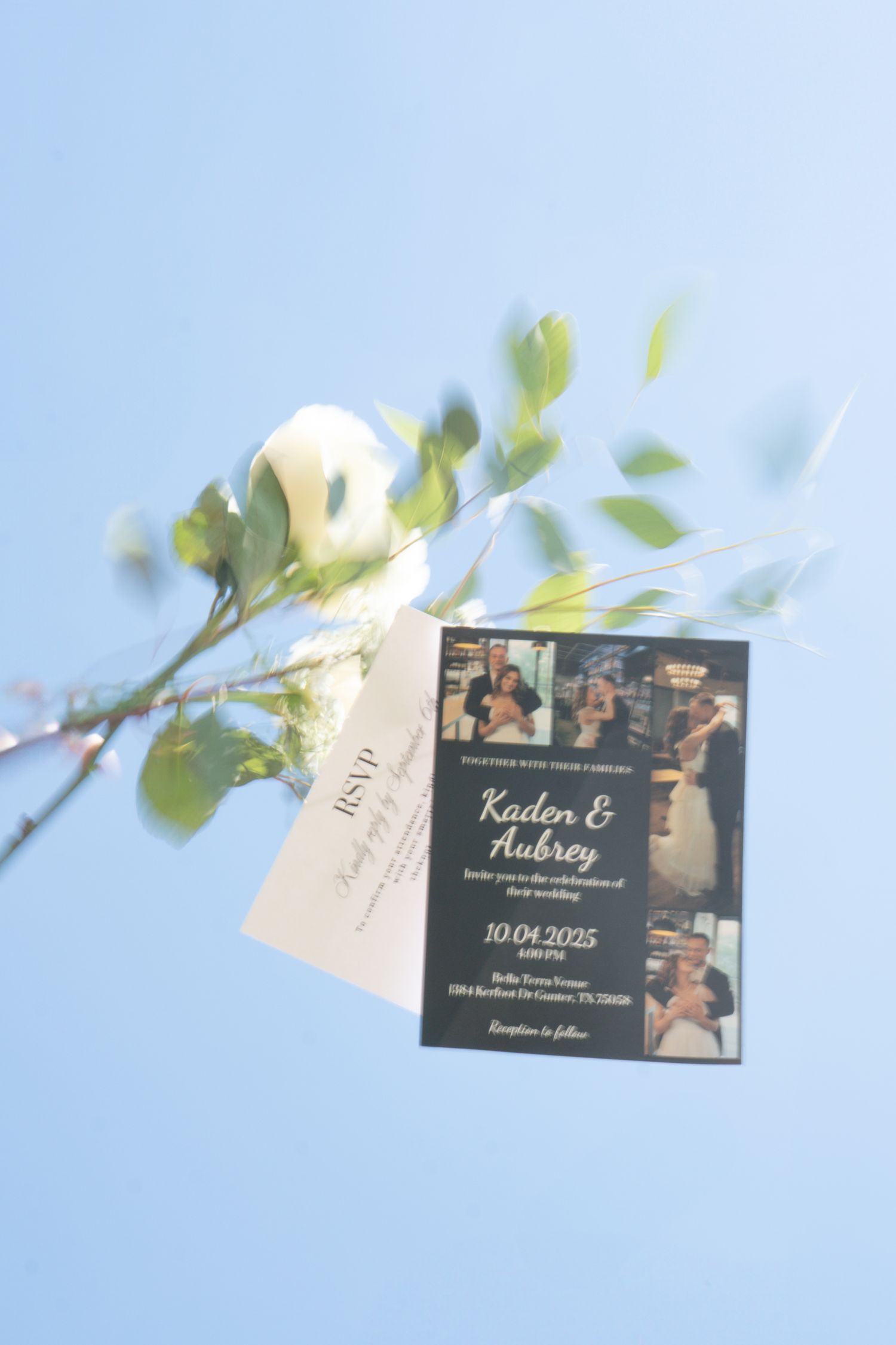 Wedding invitation for Kaden and Aubrey dated 10.04.2025 displayed with white rose and RSVP card on blue background.