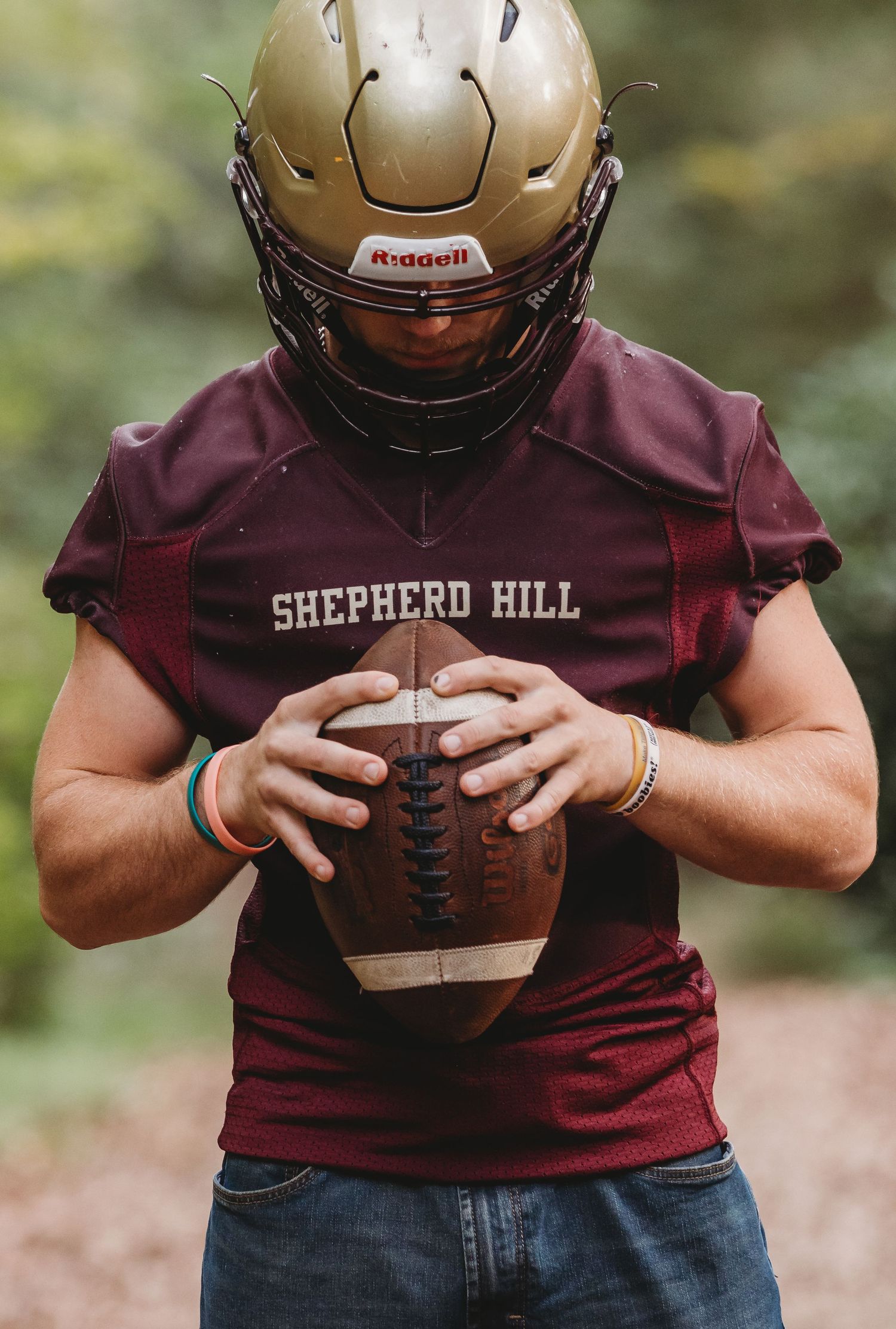 senior photoshoot football. Creative senior photo session in Central Massachusetts